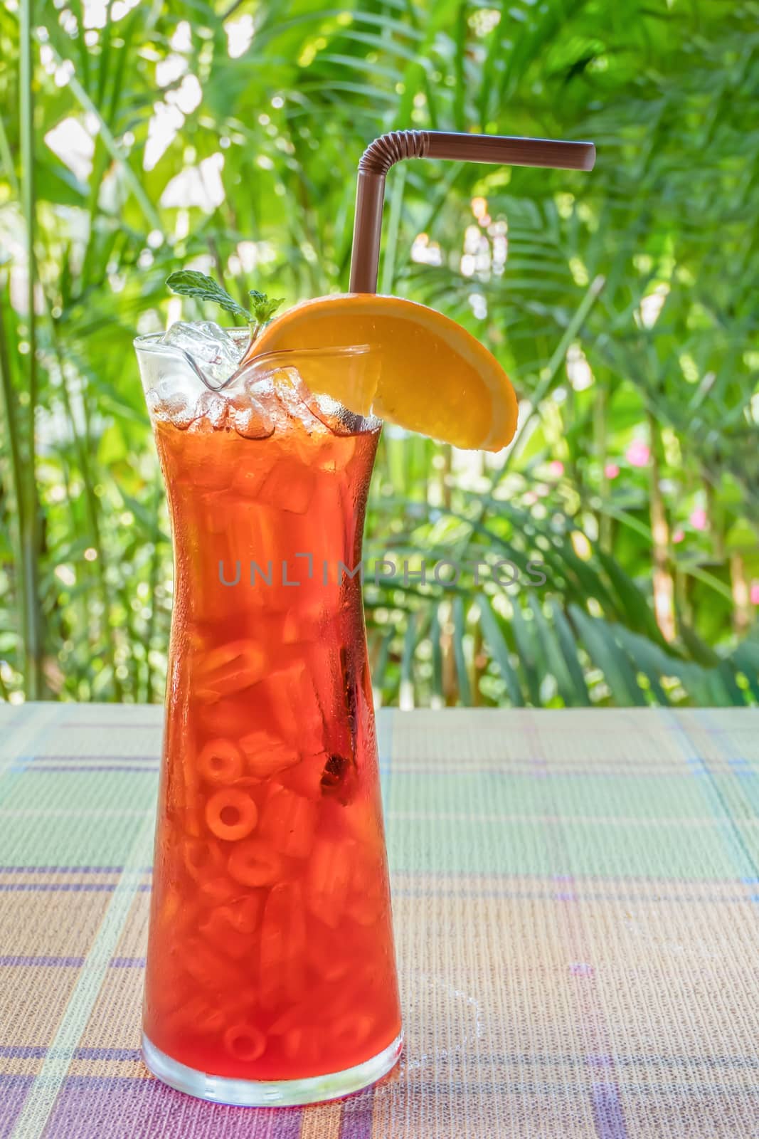 iced orange tea  on table with nature background