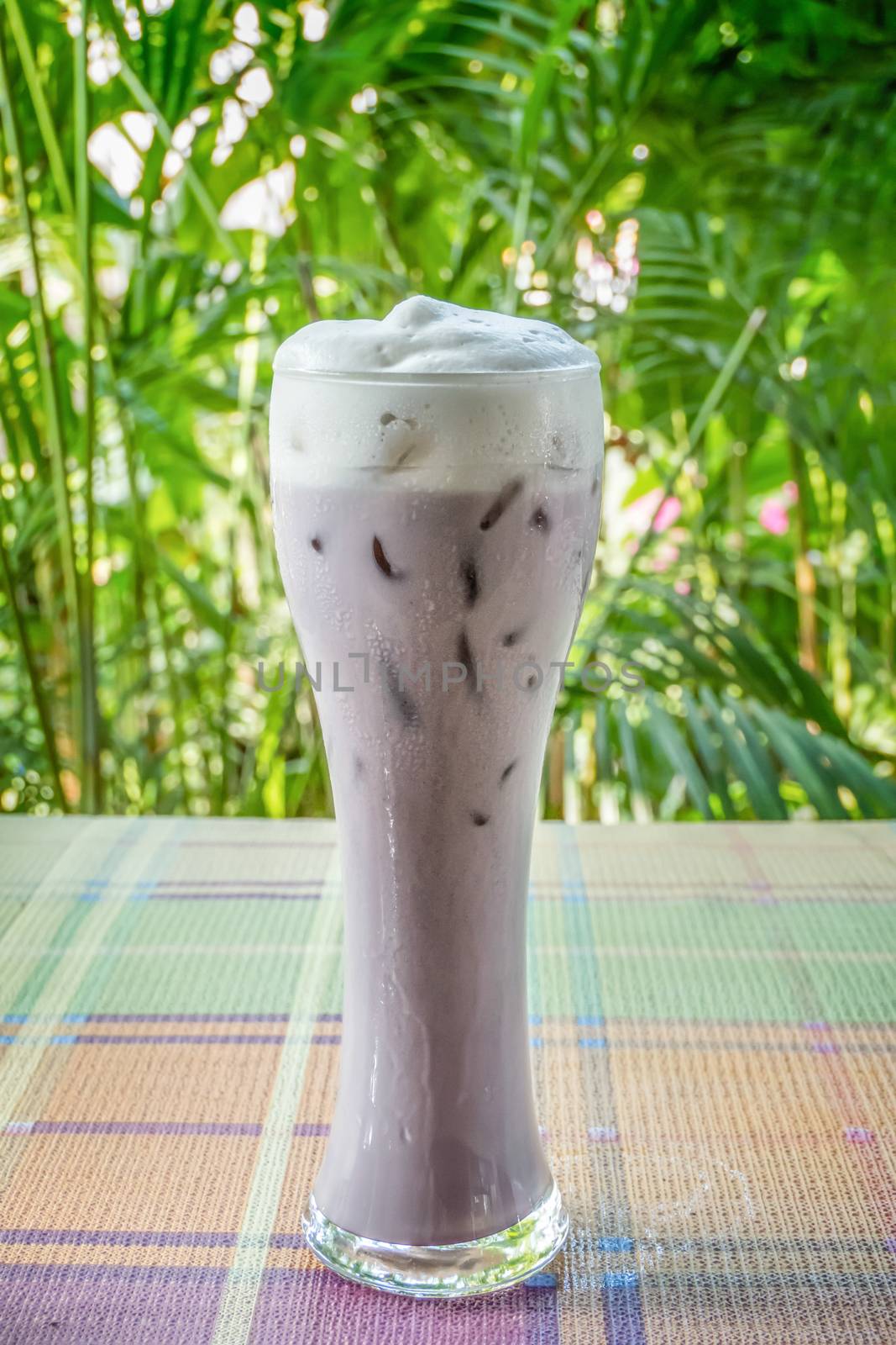 iced purple sweet potato milk  on table with nature background