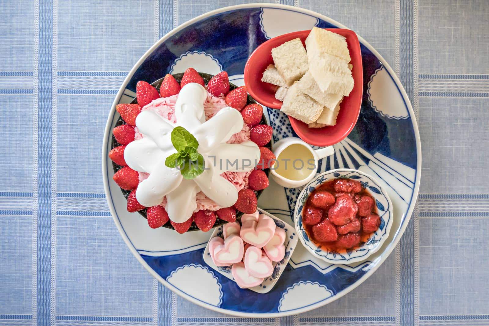 top view of Bingsu on tray served with mix  sweet topping , fruits and baked