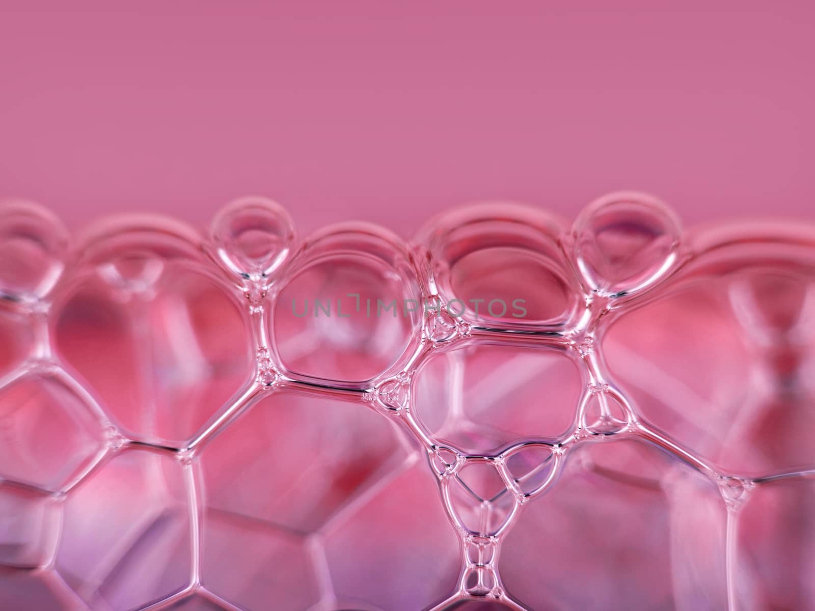 close-up shot of pink soap bubbles. suds texture