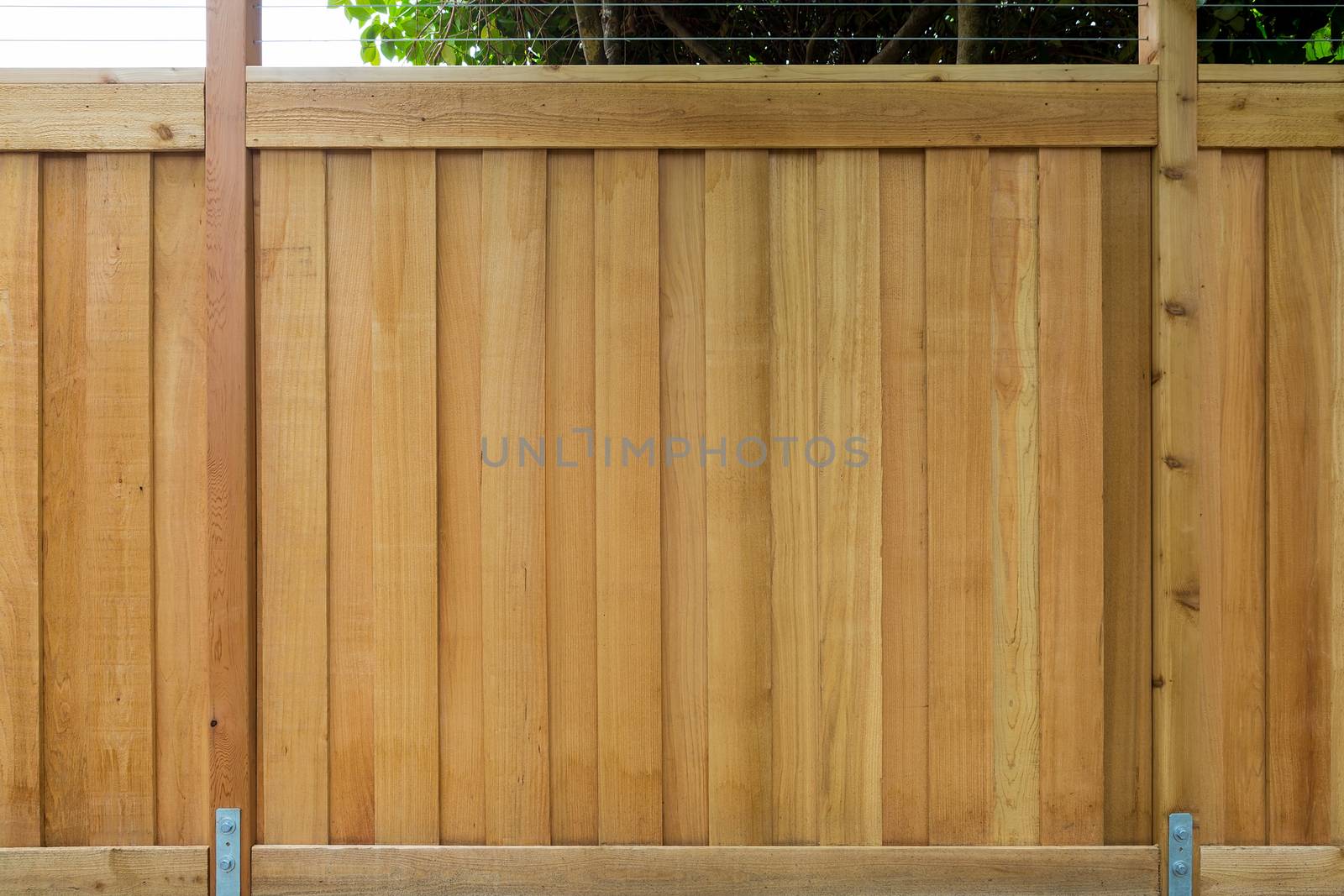 New Cedar Wood Fence around house garden property front view closeup 