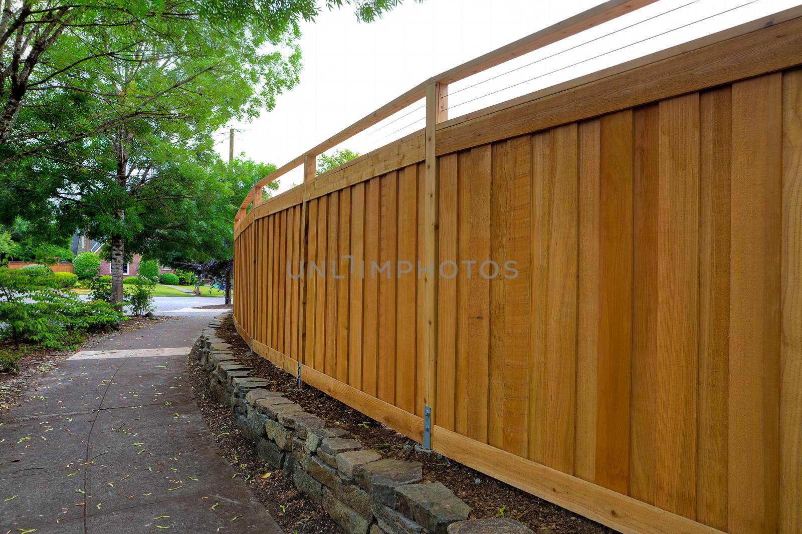 New Cedar Wood Fence around home backyard property landscaping