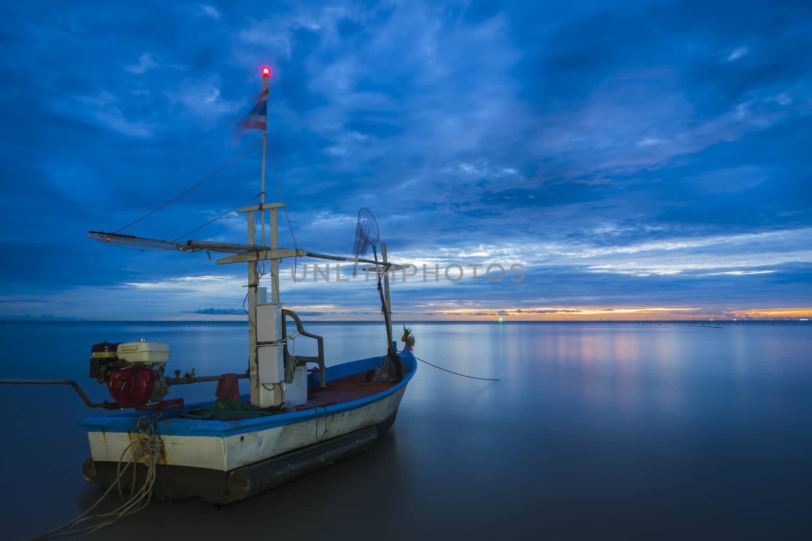 Fish boat rest on a for work in dawn by hongee