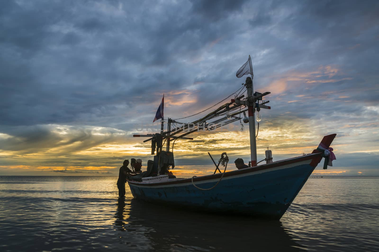 Tropical fishing boat in dawn by hongee