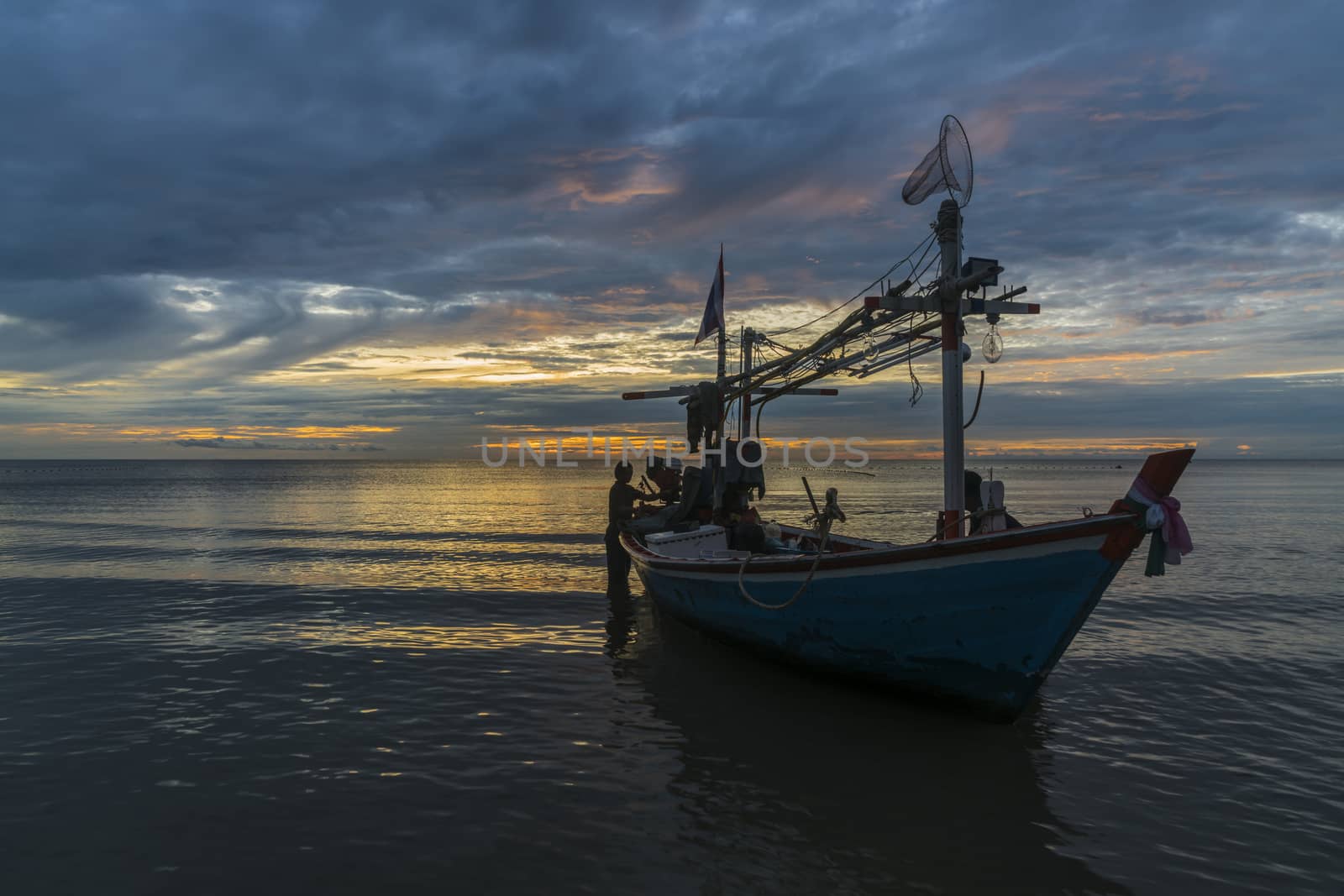 Tropical fishing boat in dawn by hongee