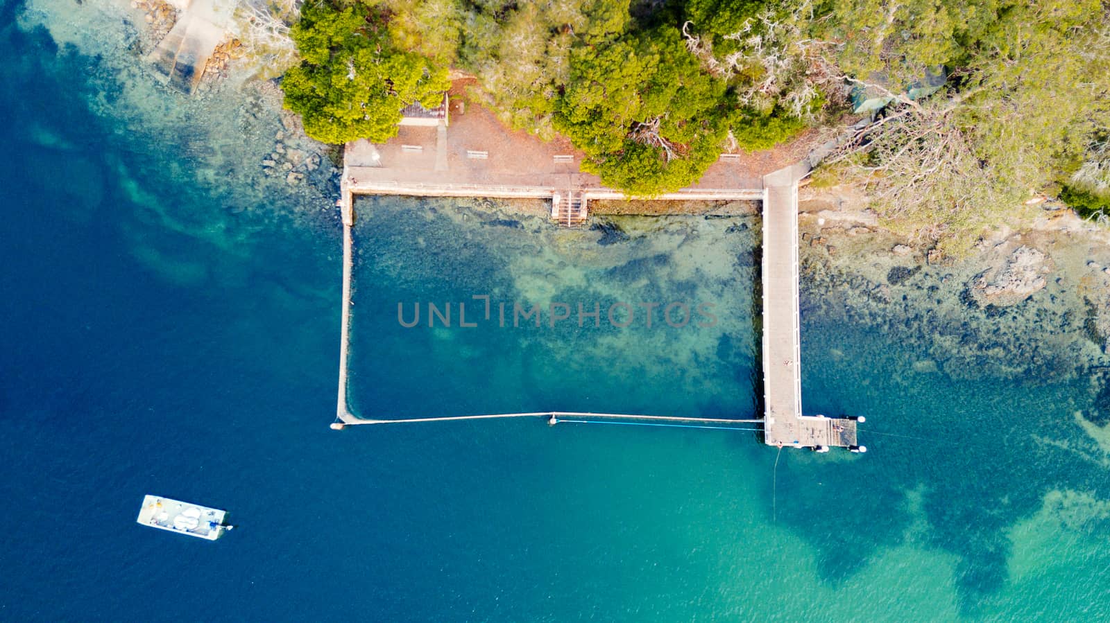 Overhead view of one of Sydney's many free coastal swimming pools.  The ocean is fenced with a free moving net.