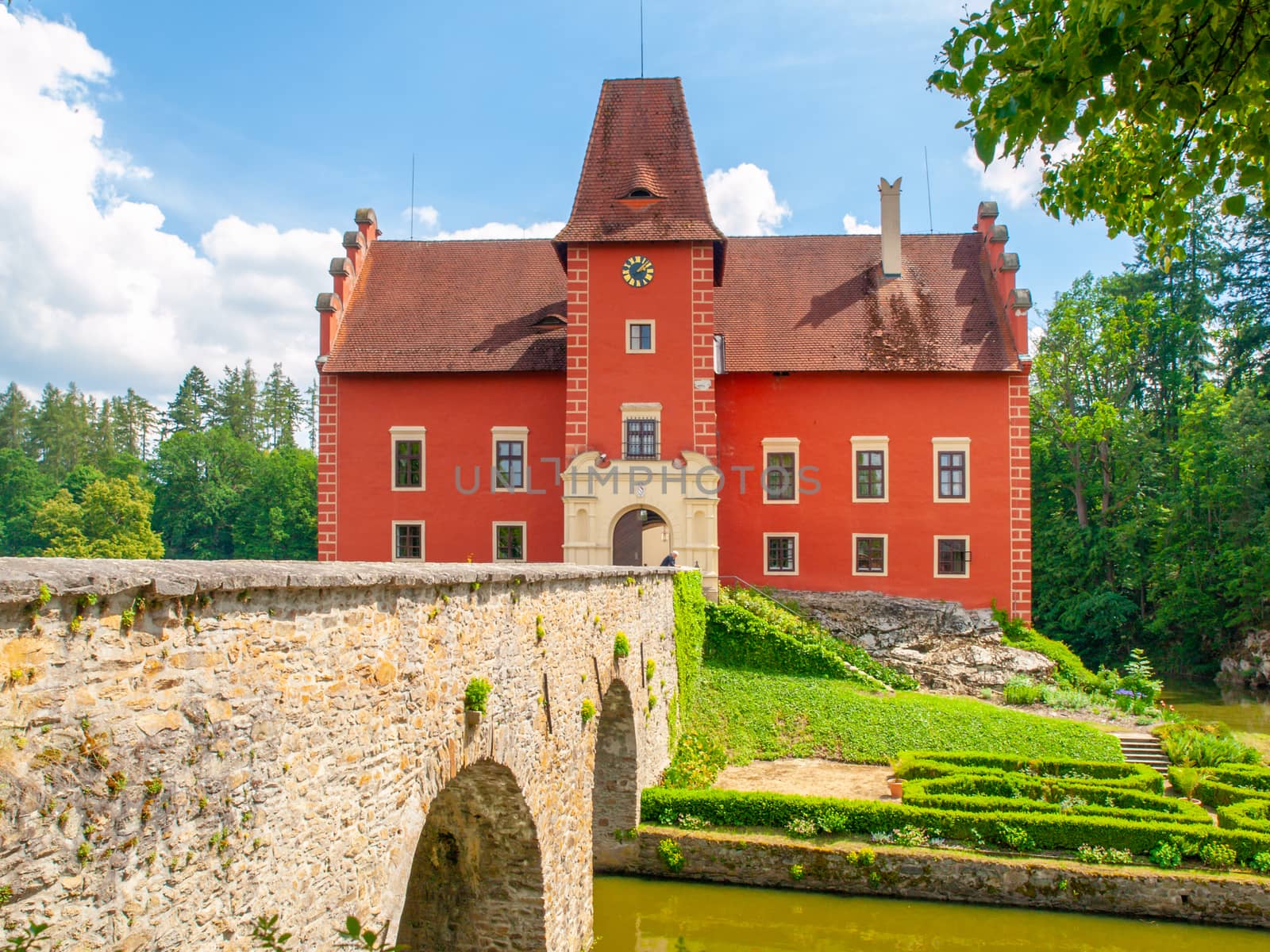 Main entrance over the bridge to Cervena Lhota - romantic red water castle, Czech Republic by pyty