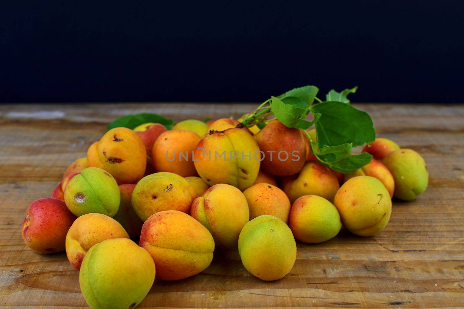 Apricots on wooden background. Apricots from rural garden.  by roman_nerud