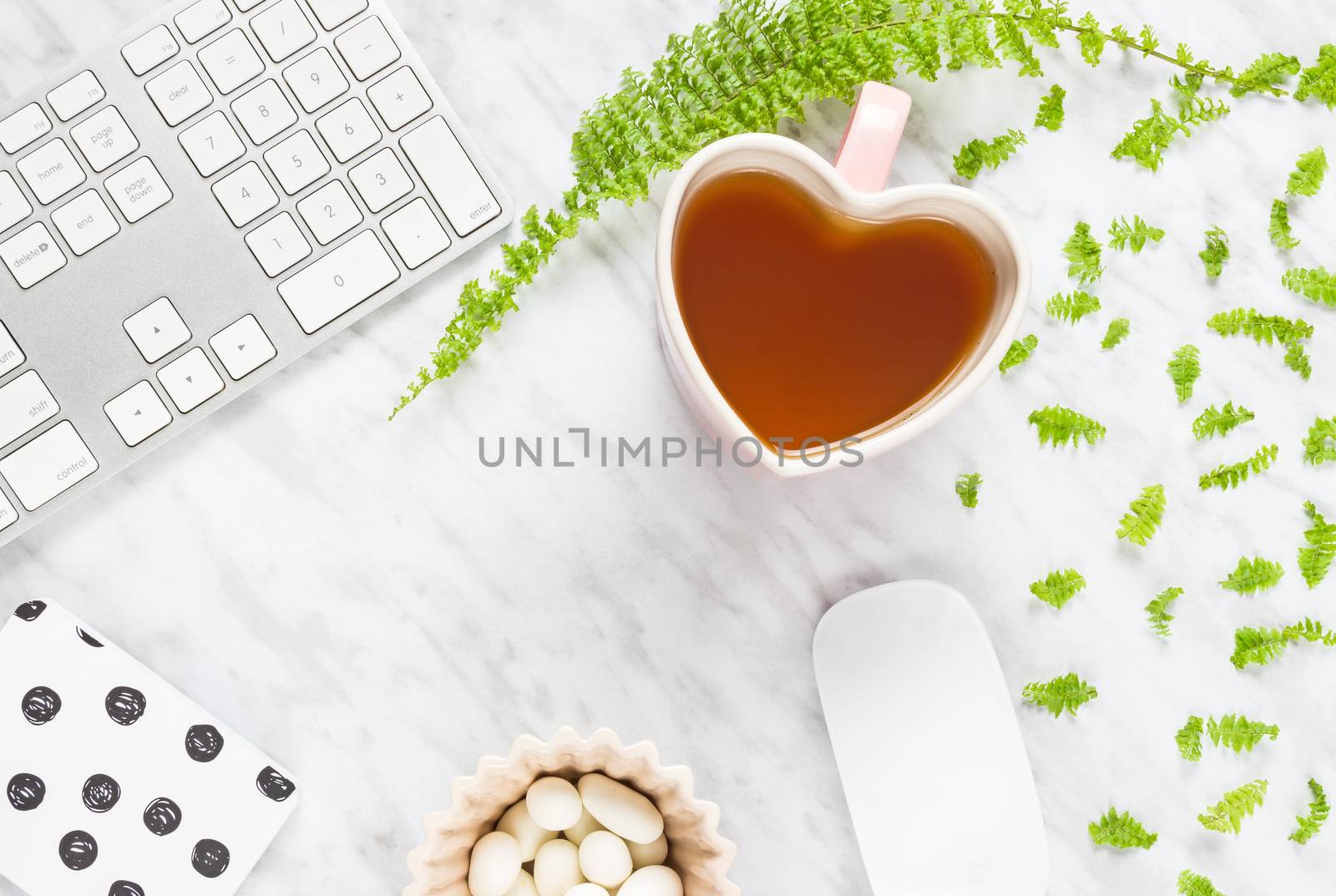 Beautiful home office workspace with heart-shaped teacup by anikasalsera