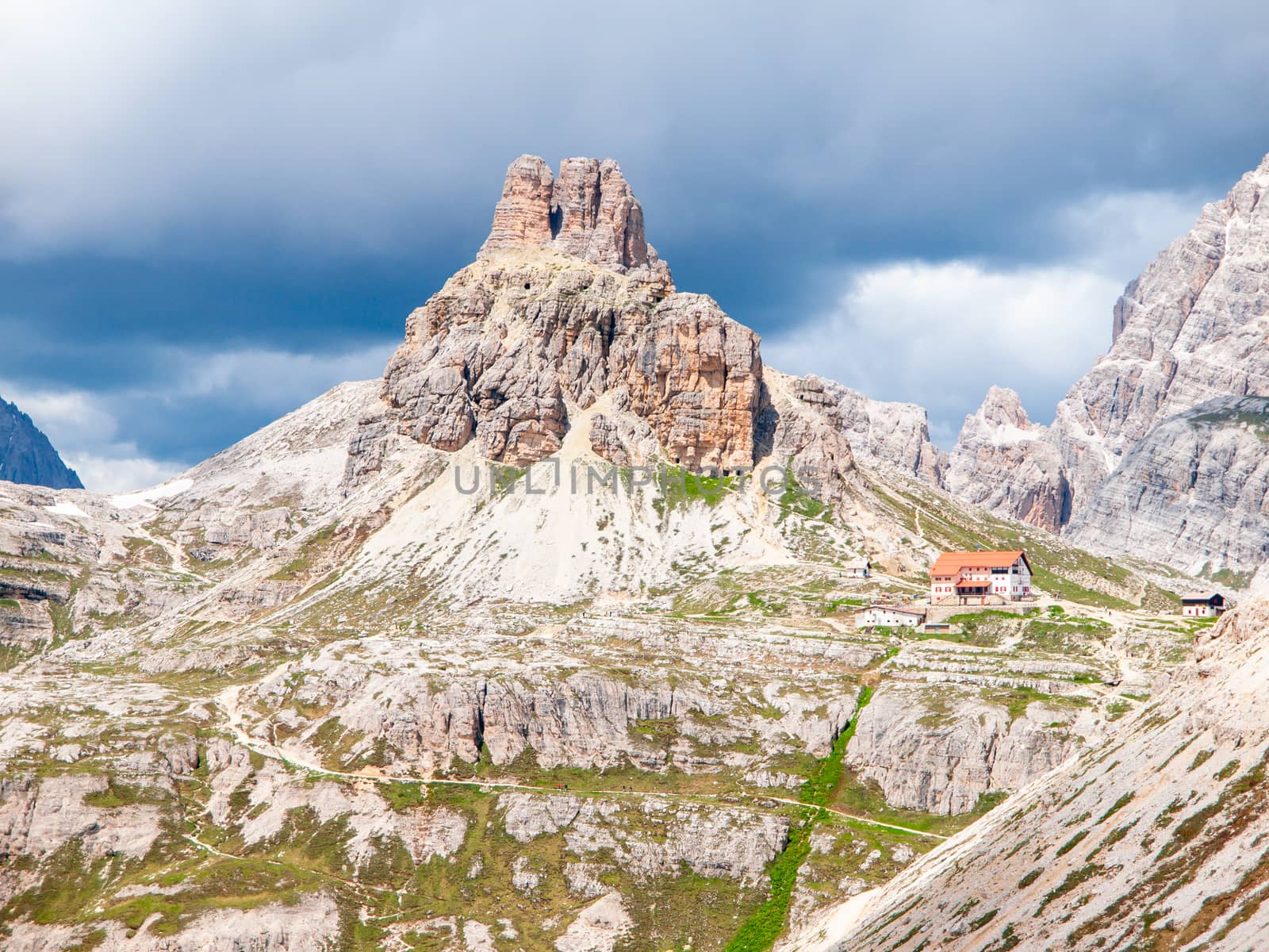 Tre Cime Hut, aka Dreizinnenhutte or Rifugion Antonio Locatelli with Torre di Toblin, aka Toblinge Knoten, on the background, Dolomites, Italy by pyty