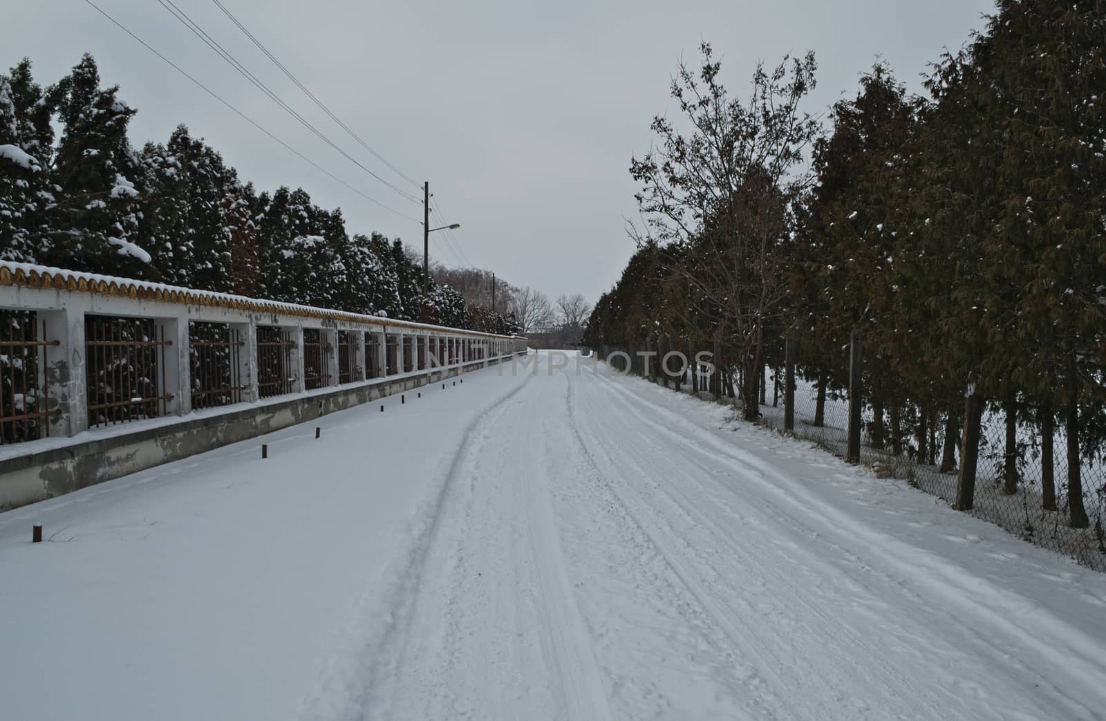 Countryside road covered with a lot of snow during winter