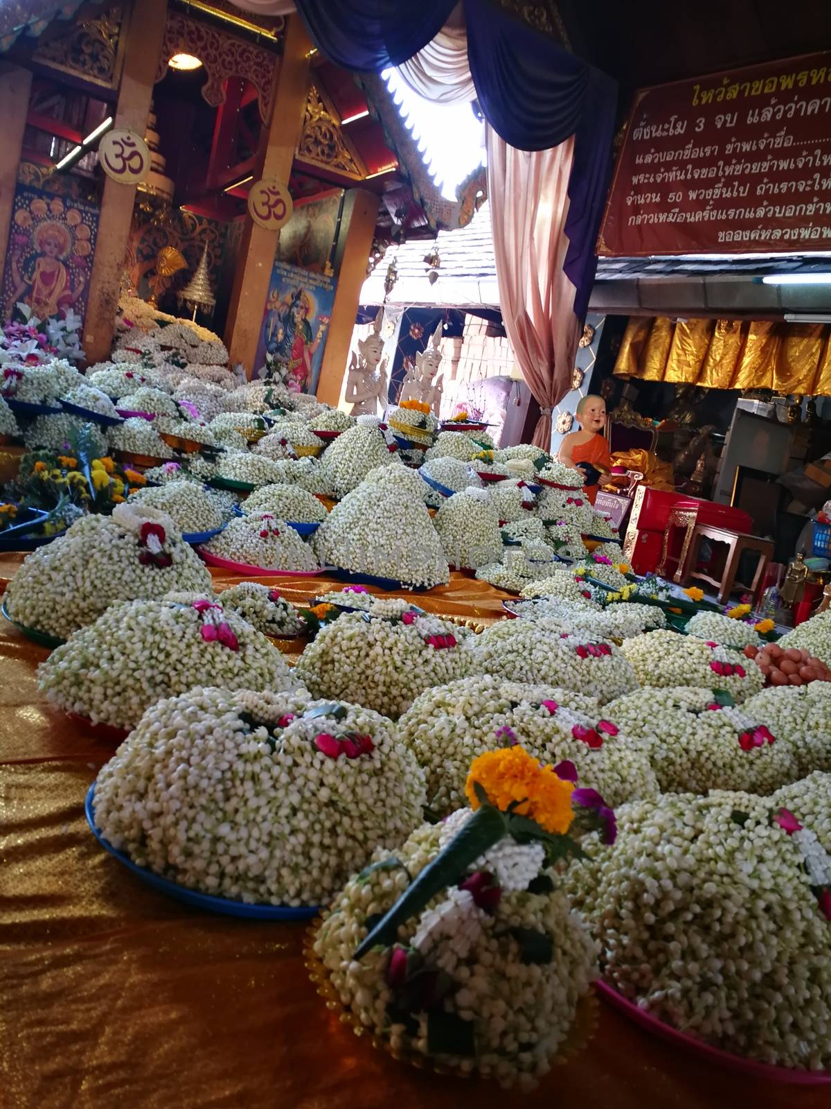 a lot of Jasmine garland flowers for play Buddha statue in Temple at the North of Thailand  at Wat Phra That Doi Kham (Temple of the Golden Mountain) Chiang Mai