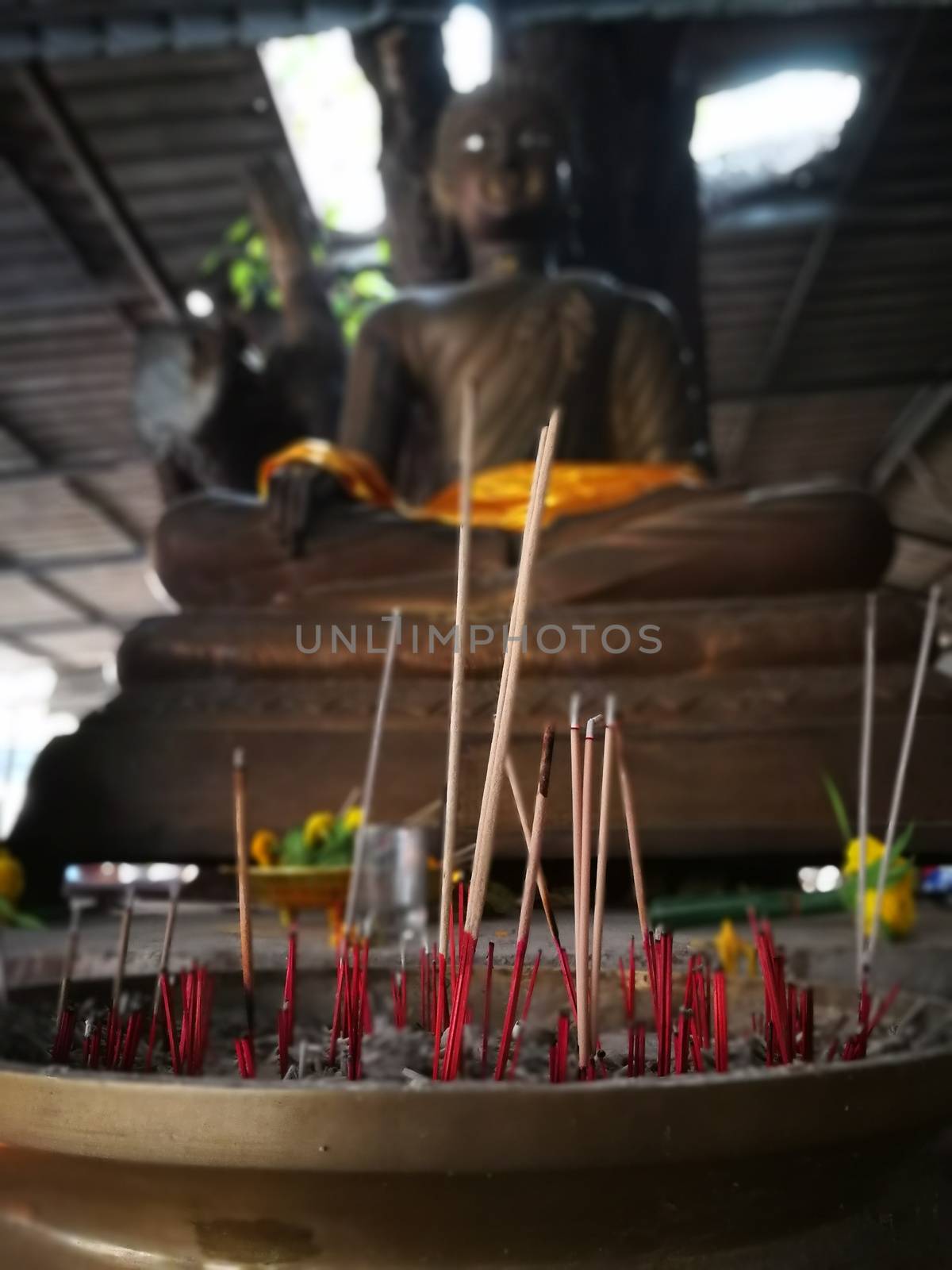 incense and candles  for Buddha statue to pray gods in Thailand Temples