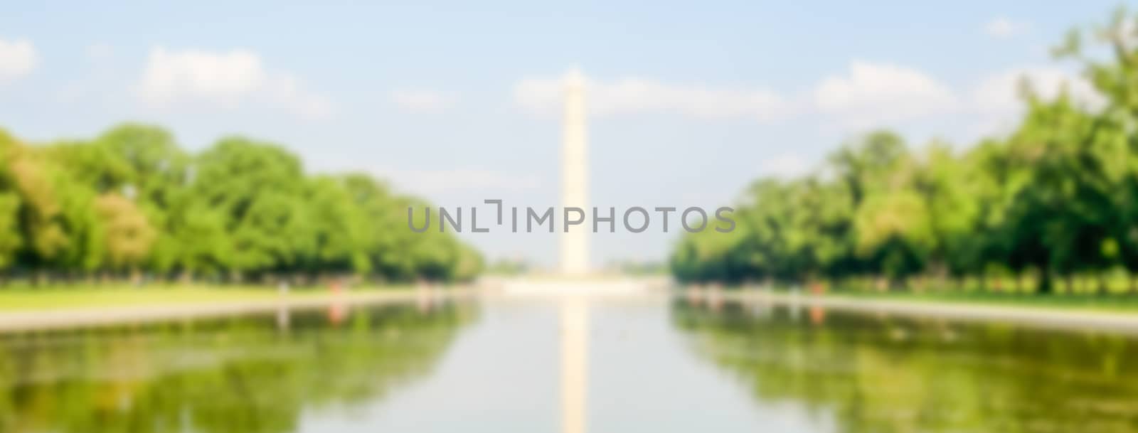 Defocused background of G. Washington Monument and Reflecting Pool, Washington DC, USA. Intentionally blurred post production for bokeh effect