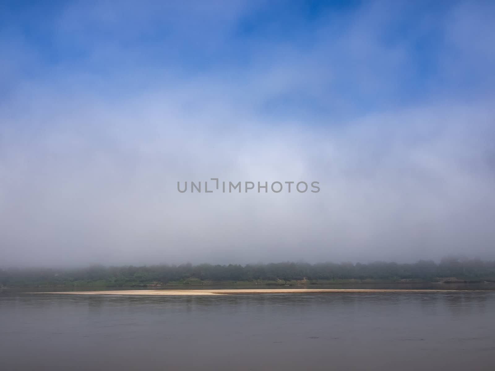 Sand bar of the Mekong River in the mist.