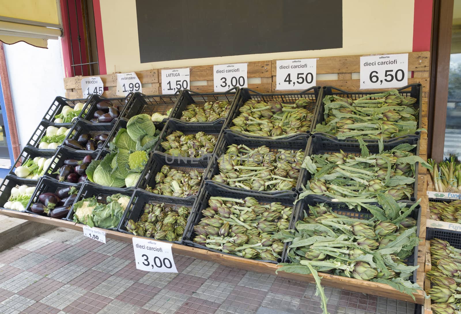 grocery stall on sardinia with leeks, artichokes, cabbage, fennel and eggplants,