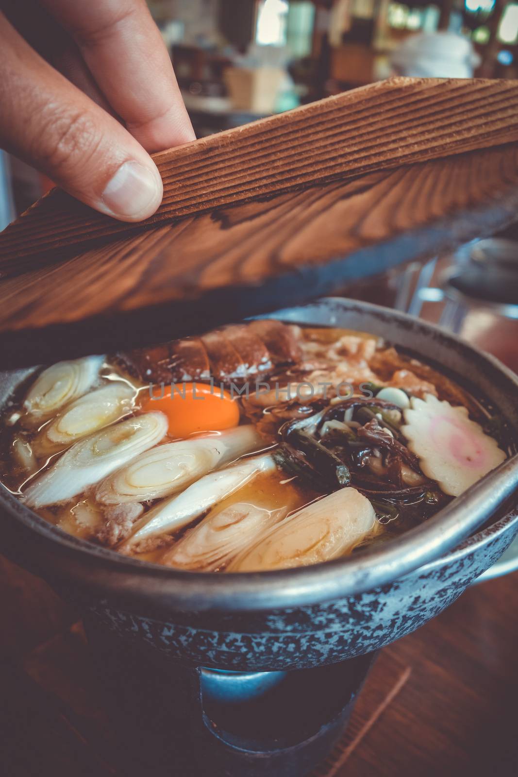 traditional japanese sukiyaki meal hot pot. Close-up view