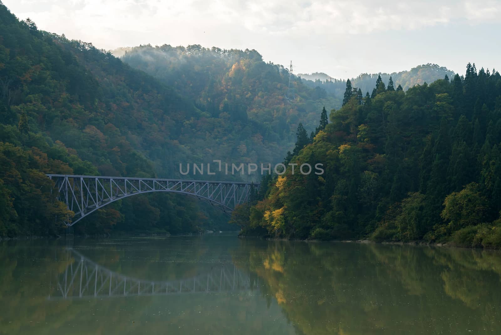 Autumn fall foliage Fukushima First Bridge daiichi kyouryou from Tadami River bank  in Mishima Fukushima Japan
