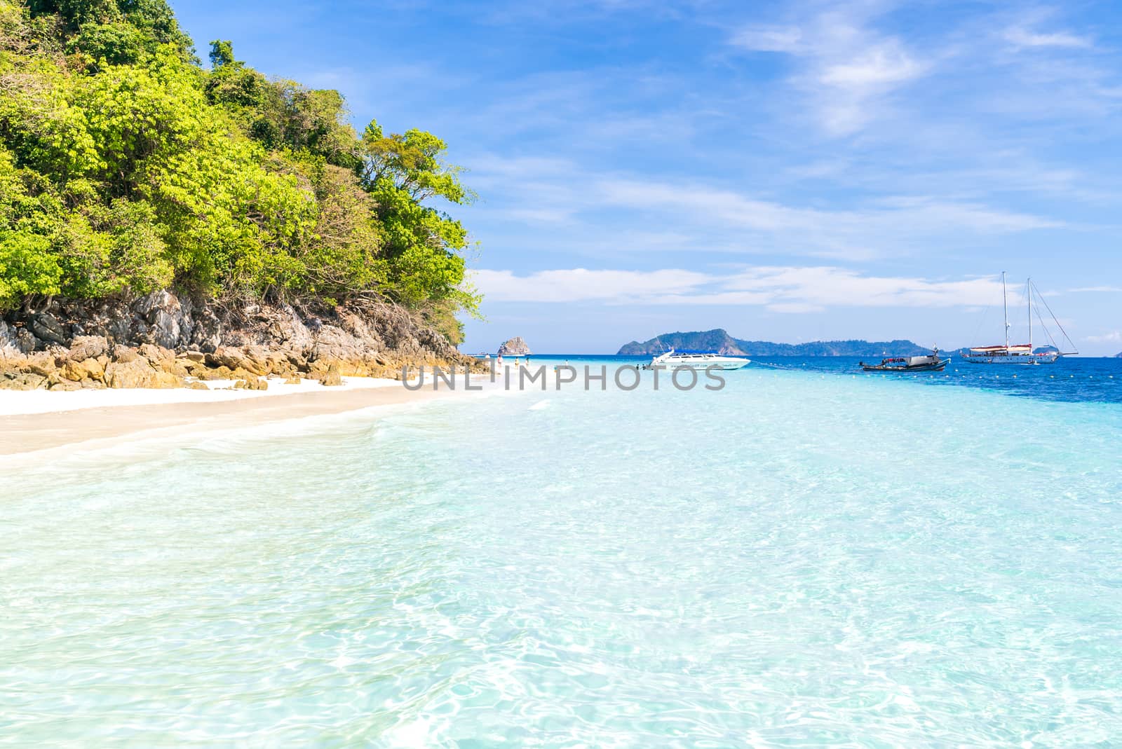 Tropical white sand beach at snoekel point from speed boat at andaman sea indian ocean Myanmar and Thailand.