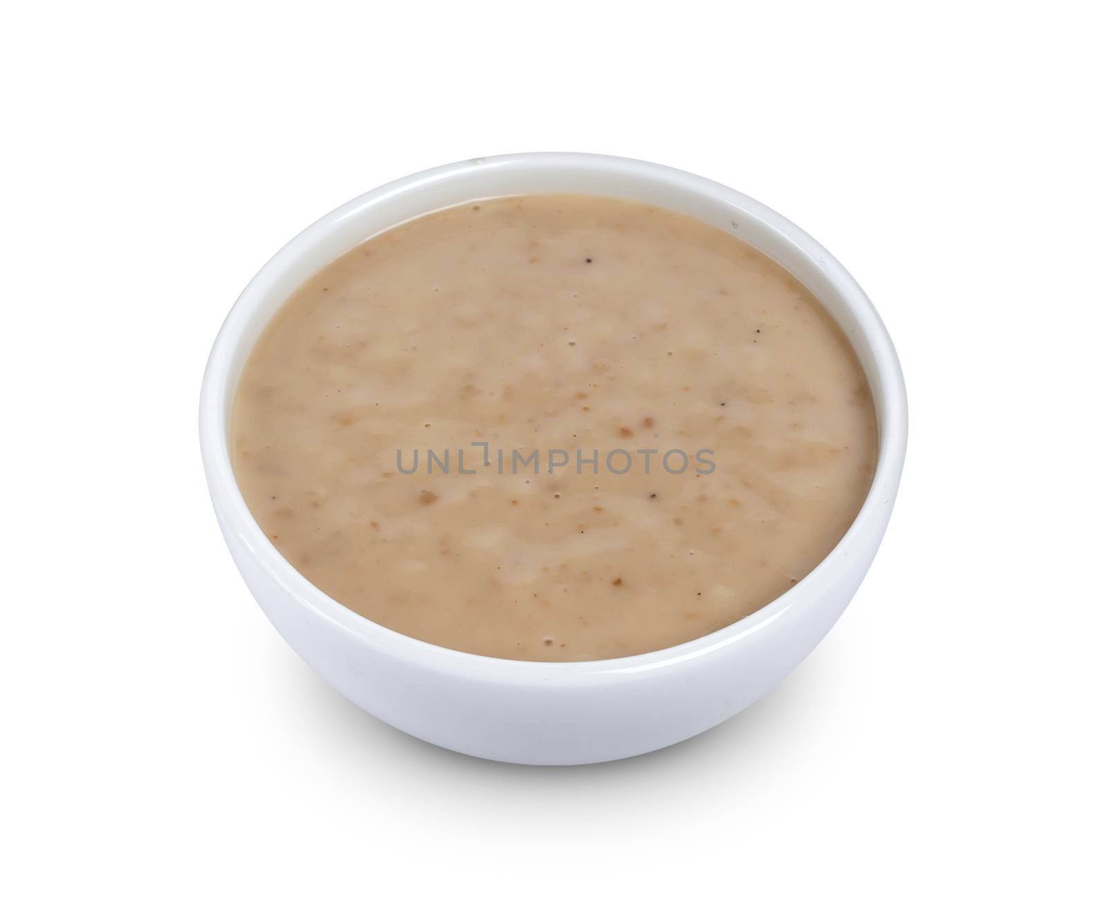 Sesame sauce. Tahini isolated on white background by xamtiw