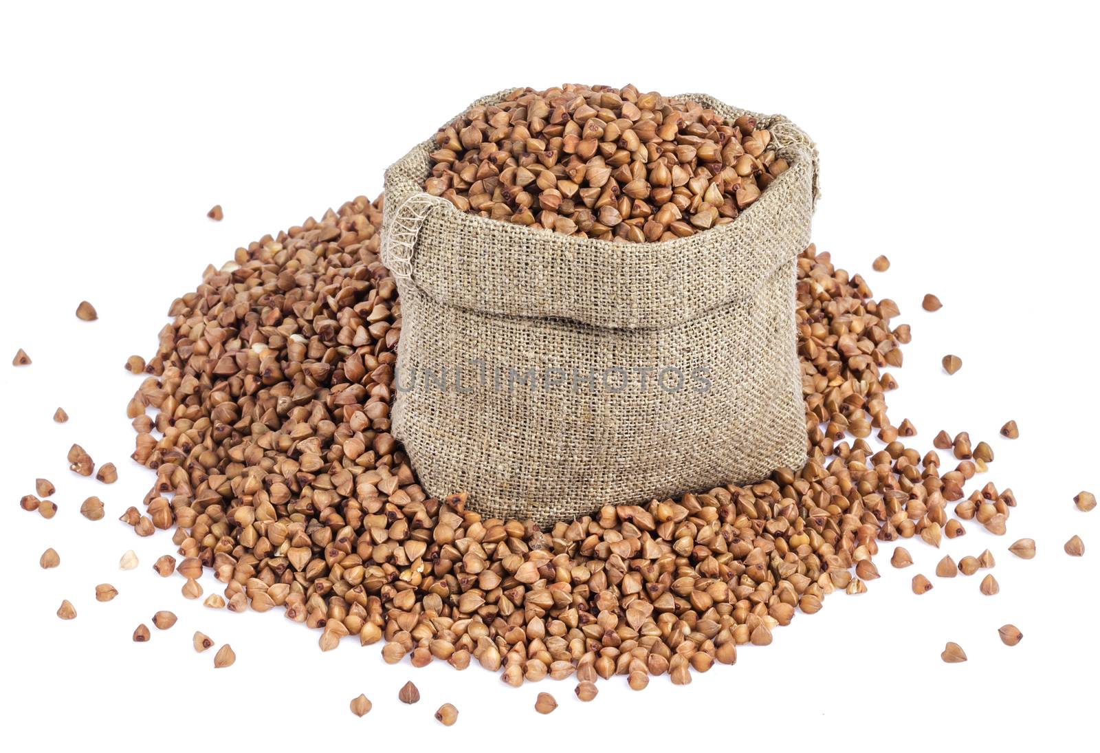 Buckwheat in bag isolated on white background with clipping path. Closeup