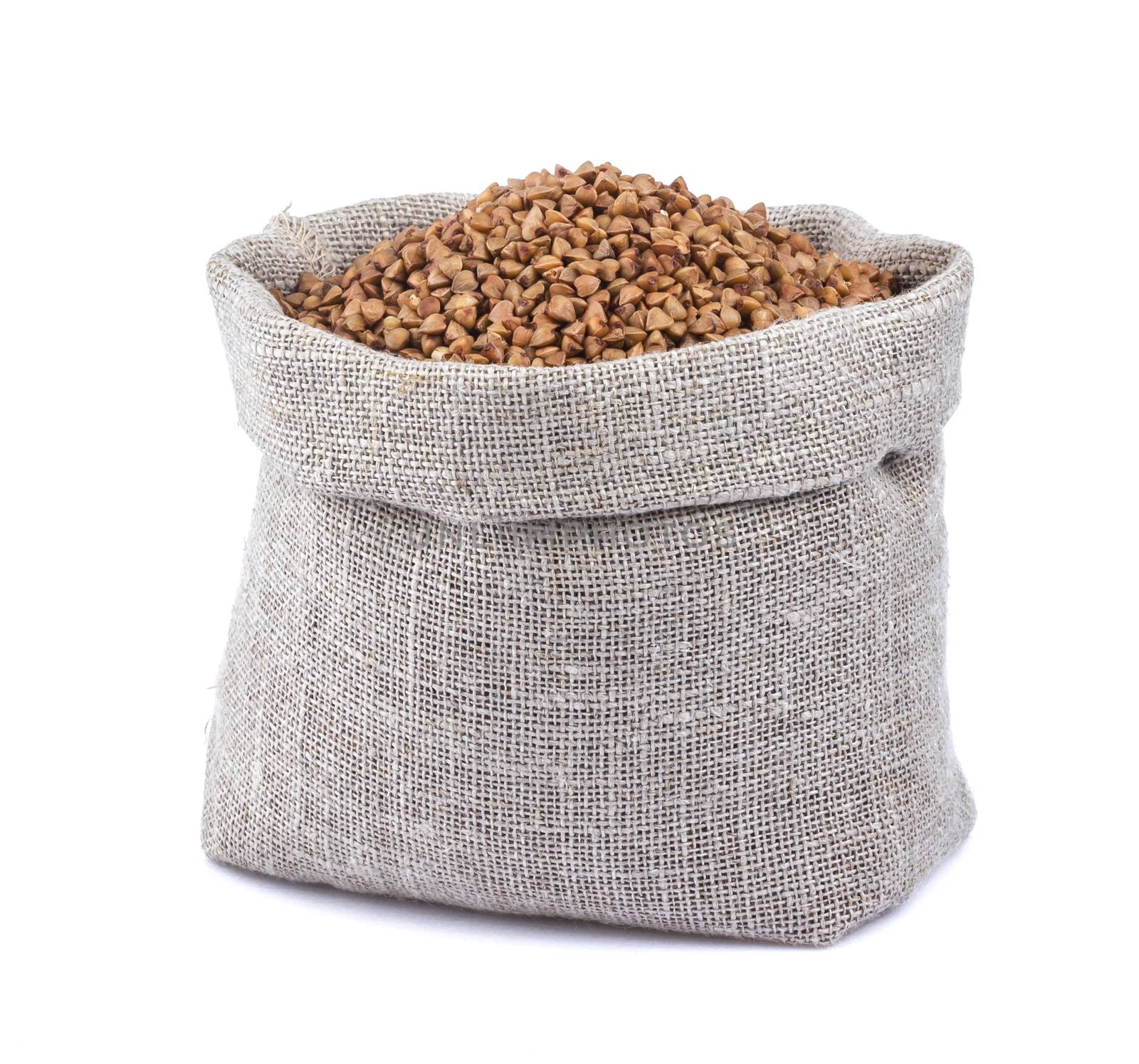 Buckwheat in bag isolated on white background with clipping path. Closeup