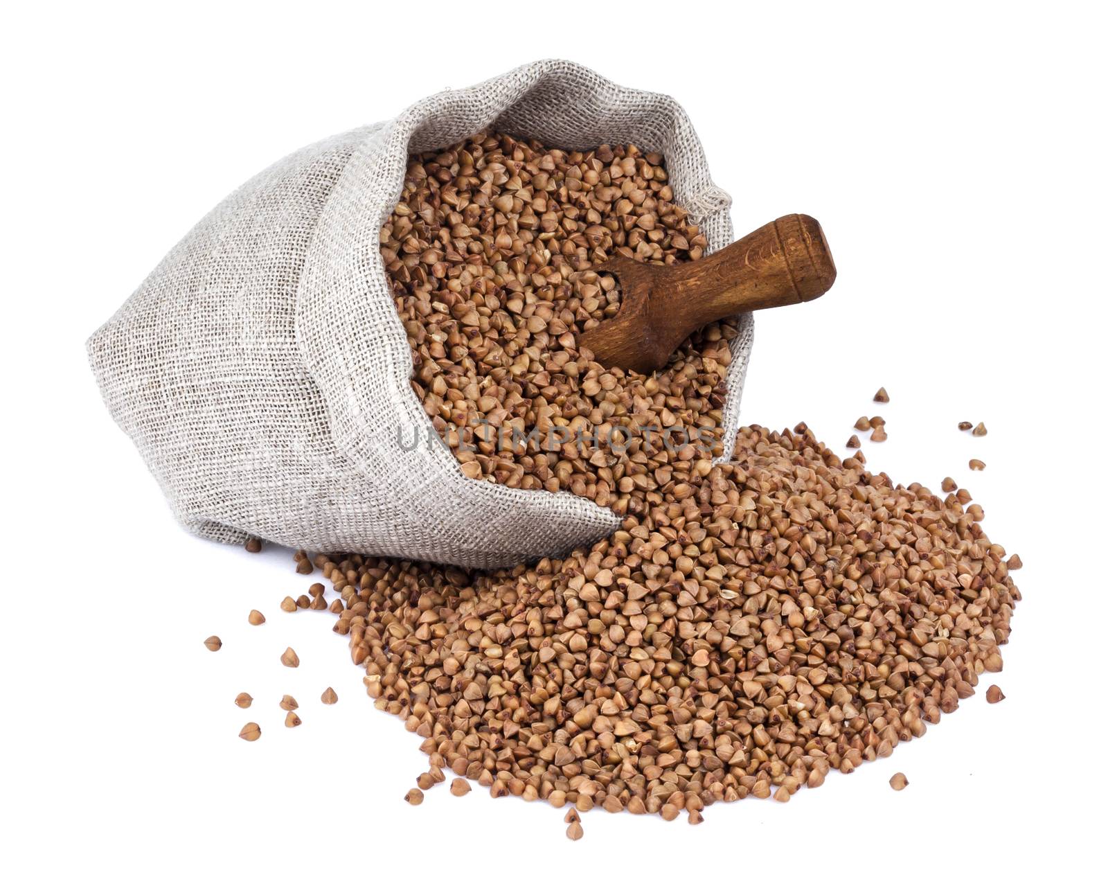 Buckwheat in bag isolated on white background with clipping path. Closeup