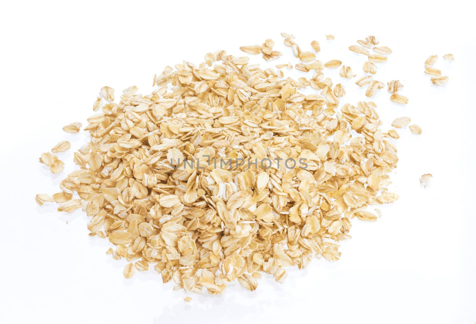 Oat flakes isolated on white background. Top view. Close up.