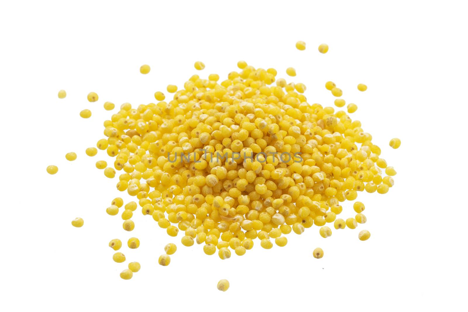Heap of millet groats isolated on white background with clipping path. Close-up, top view.