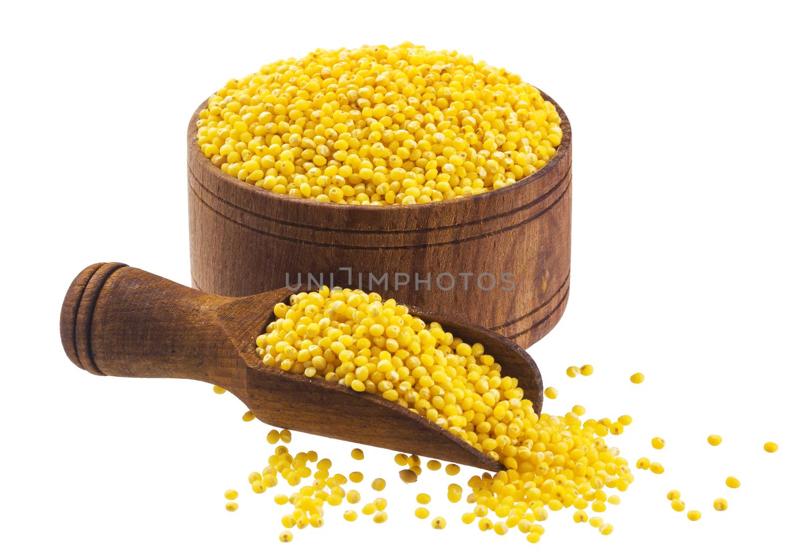 Millet in wooden bowl isolated on white background with clipping path. Close-up