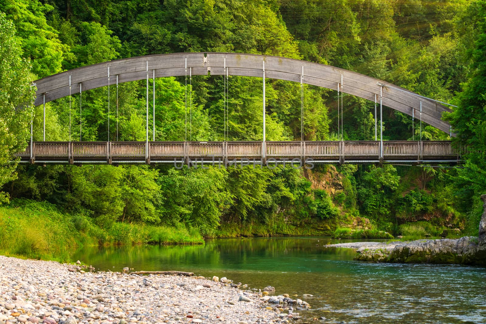 View of the Serio Bridge from the river during the day,wonderful sunbeams crossing the bridge, Val Seriana Bergamo.