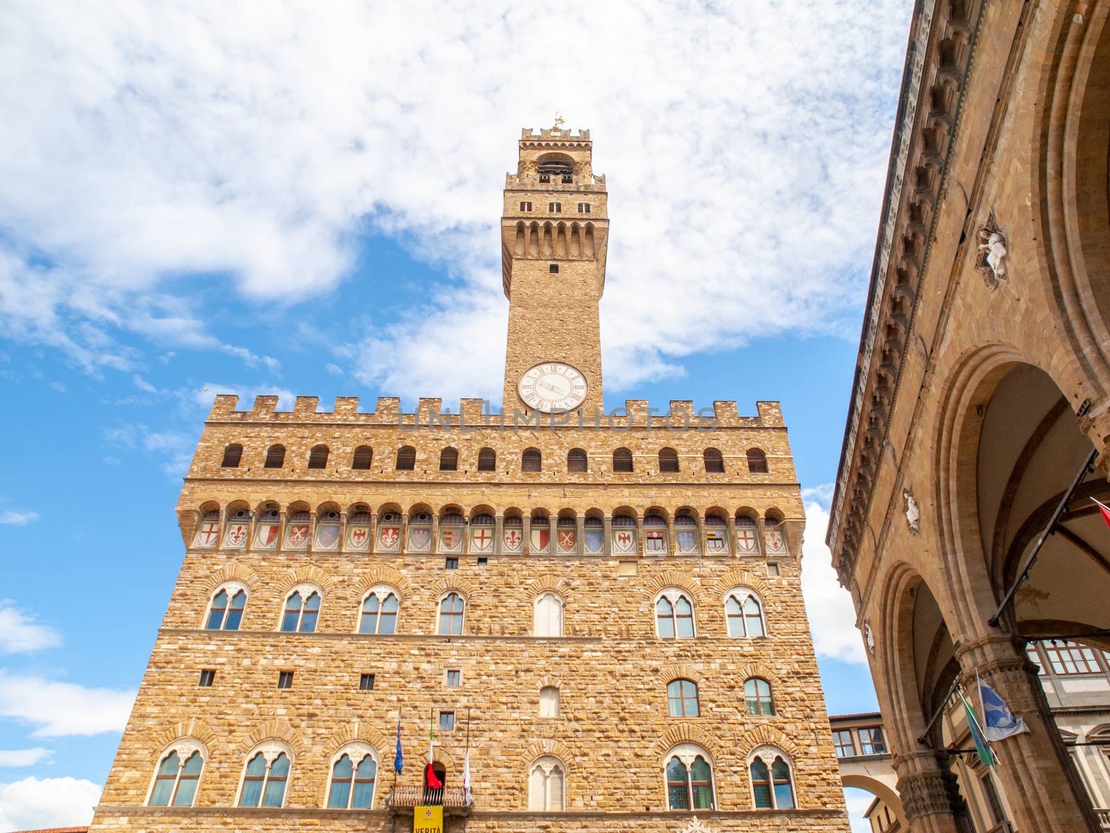 Bottom view of Pallazo Vecchio, Old Palace - Town Hall, with high bell tower, Piazza della Signoria, Florence, Tuscany, Italy by pyty