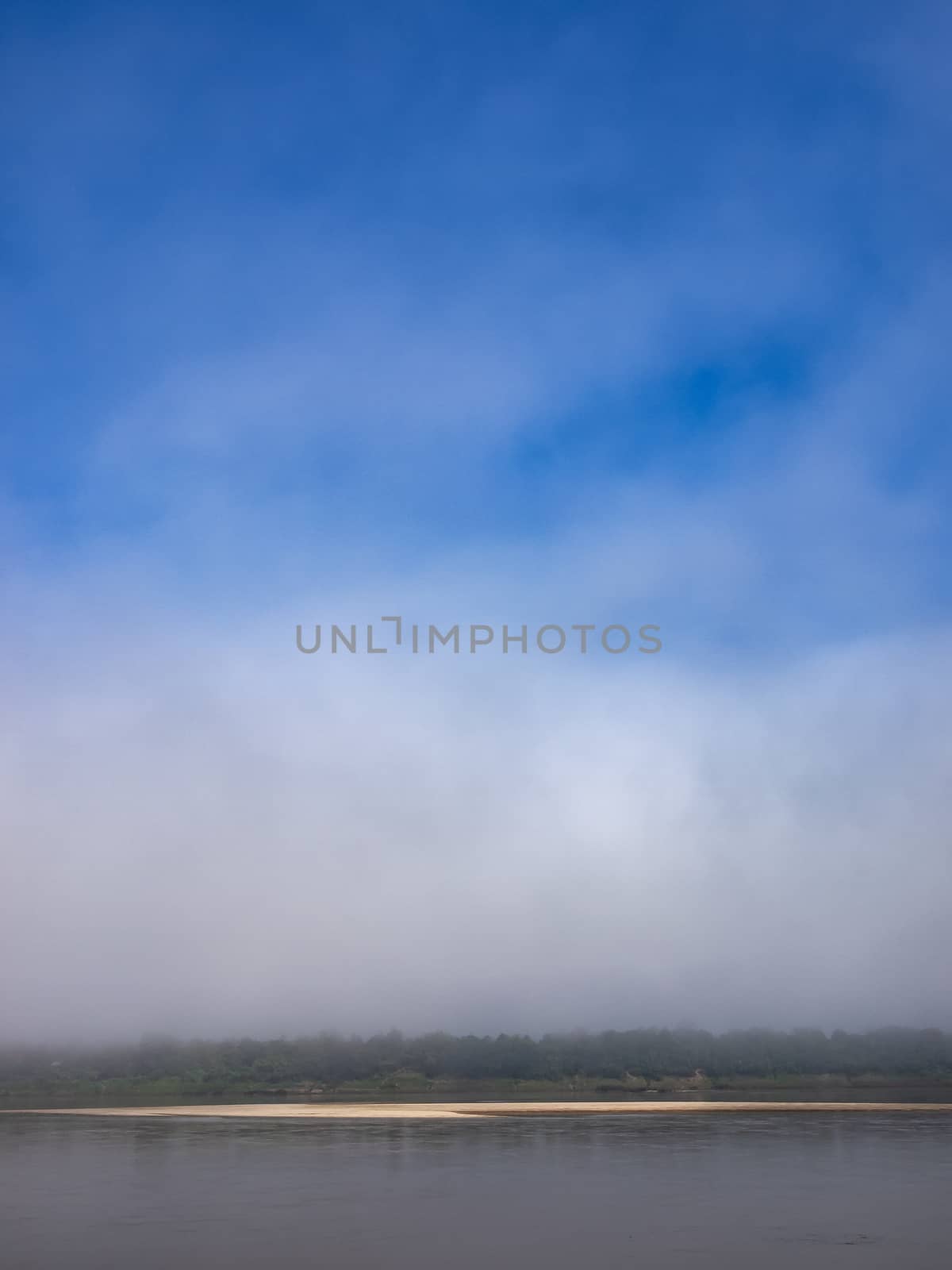 Sand bar of the Mekong River in the mist.