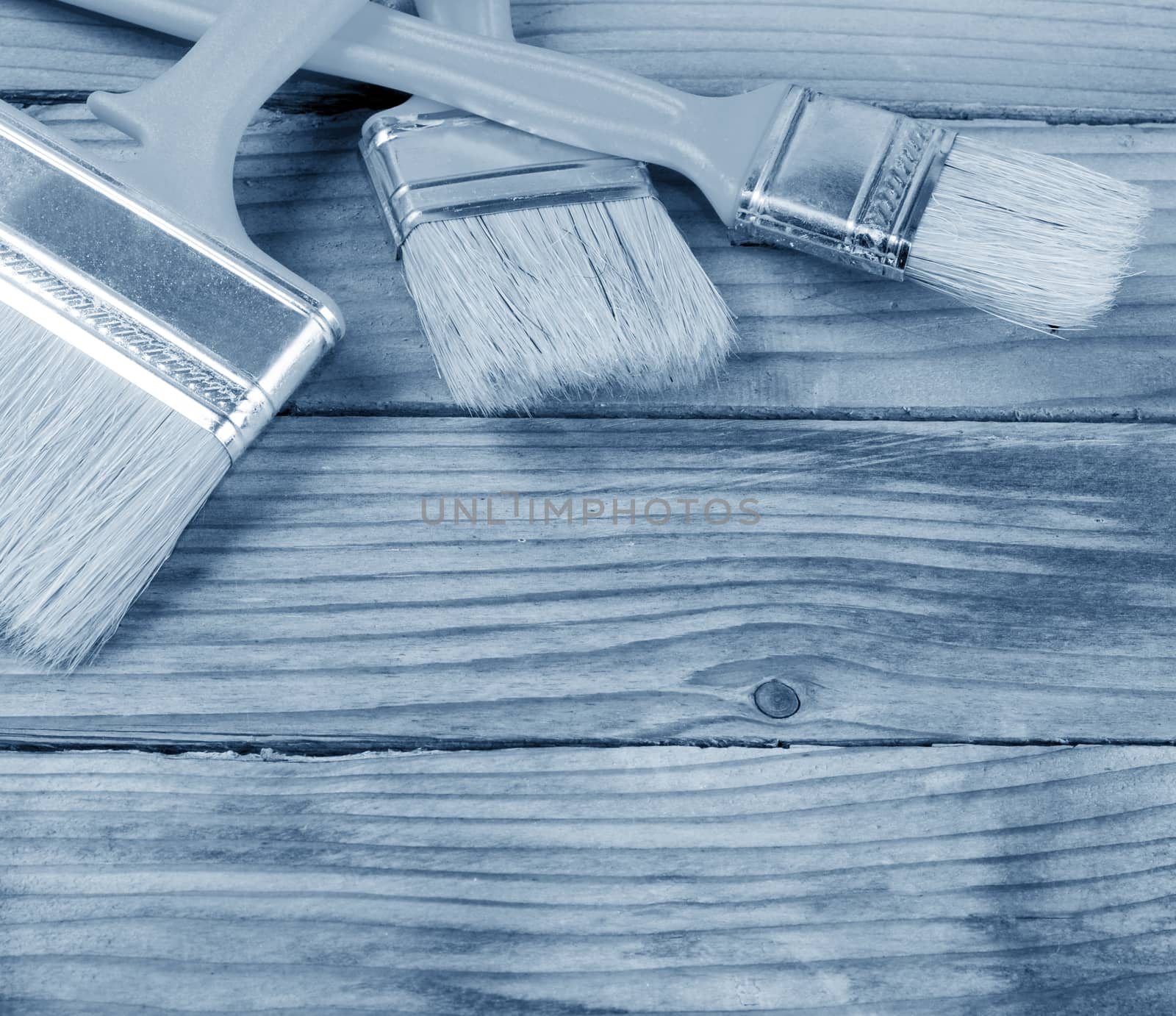 Brush painting paint on wooden background by SvetaVo