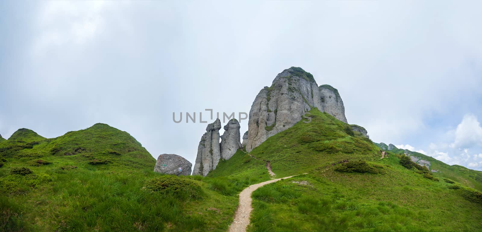 Panoramic view of Mount Ciucas on summer with rock formations by PixAchi