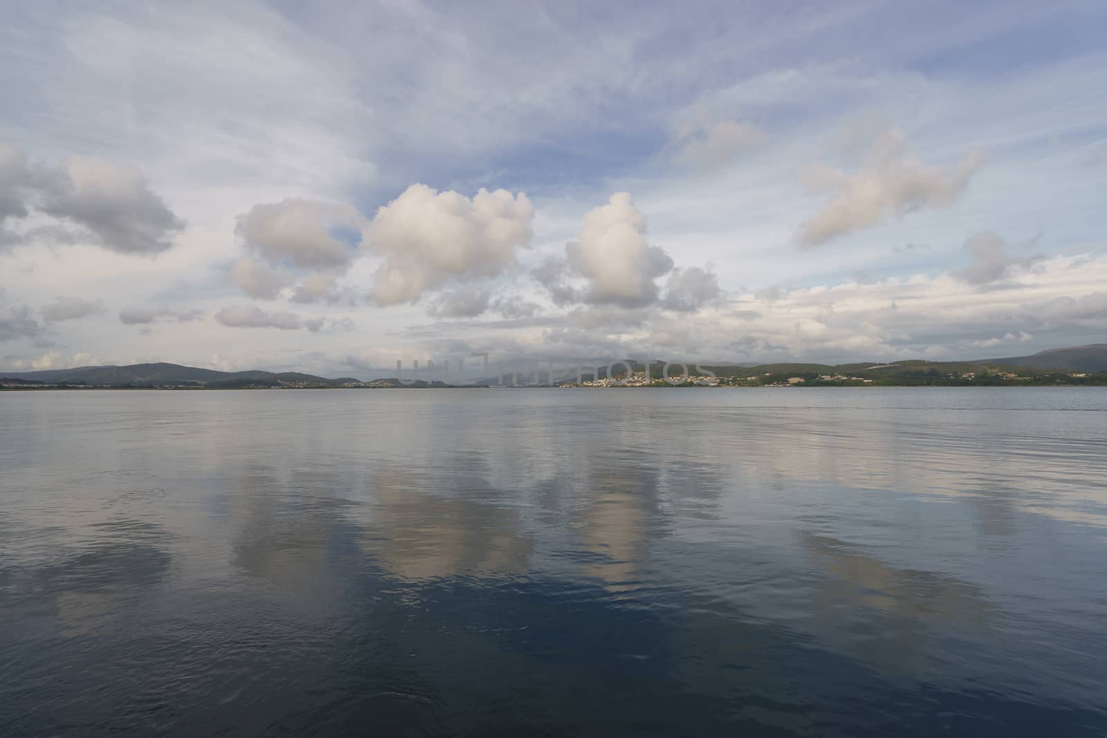 The river flows into the Atlantic Ocean here. The place where the sky converges with the earth, clouds reflect in water