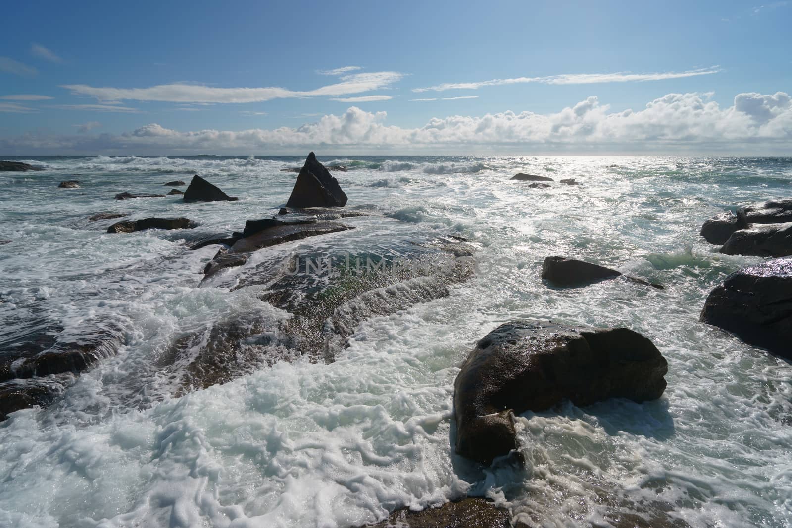 Ocean daytime landscape, giving strength. The space is filled with water, spray and ocean noise