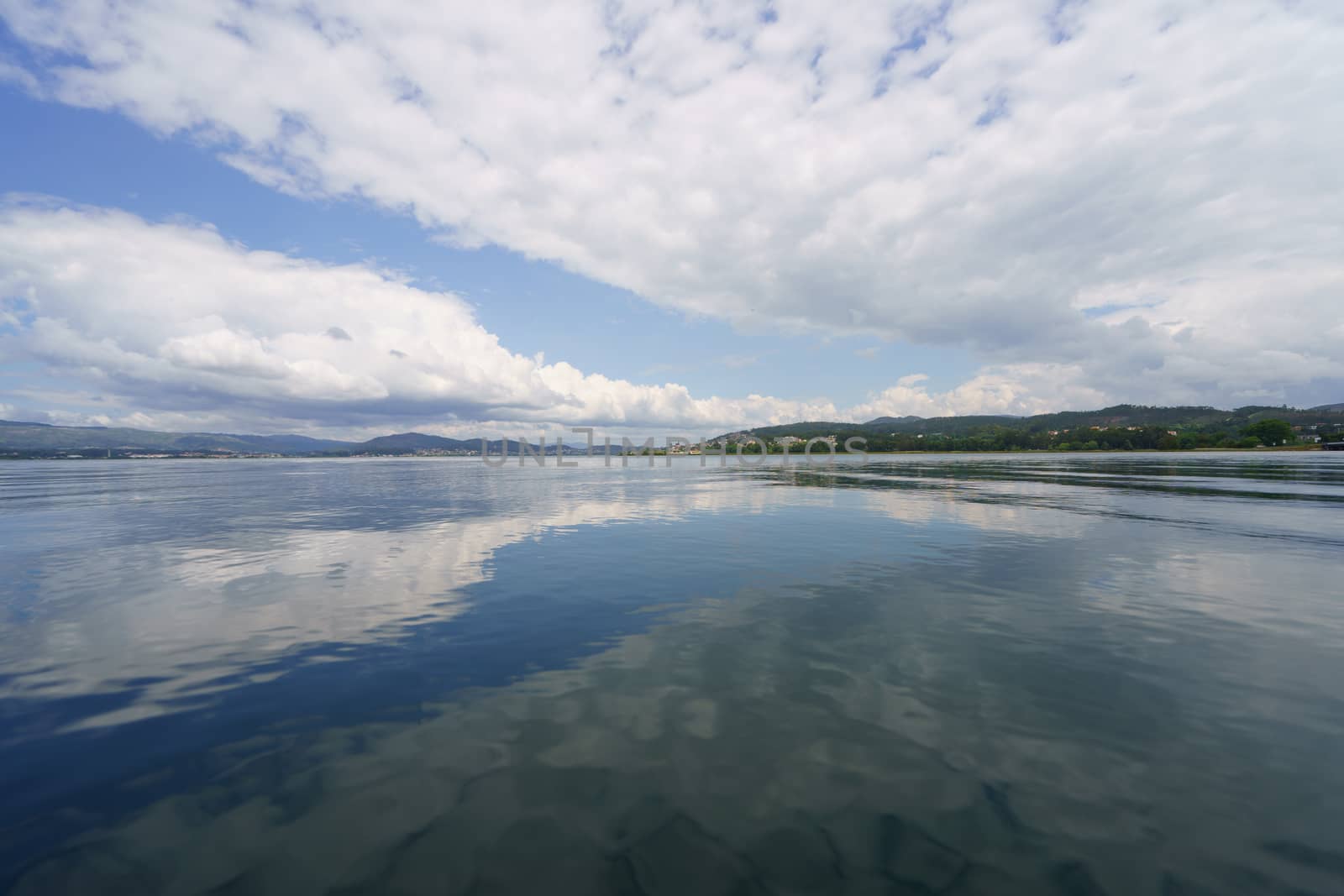 The river Minya flows into the Atlantic Ocean here. The place where the sky converges with the earth, clouds reflect in water