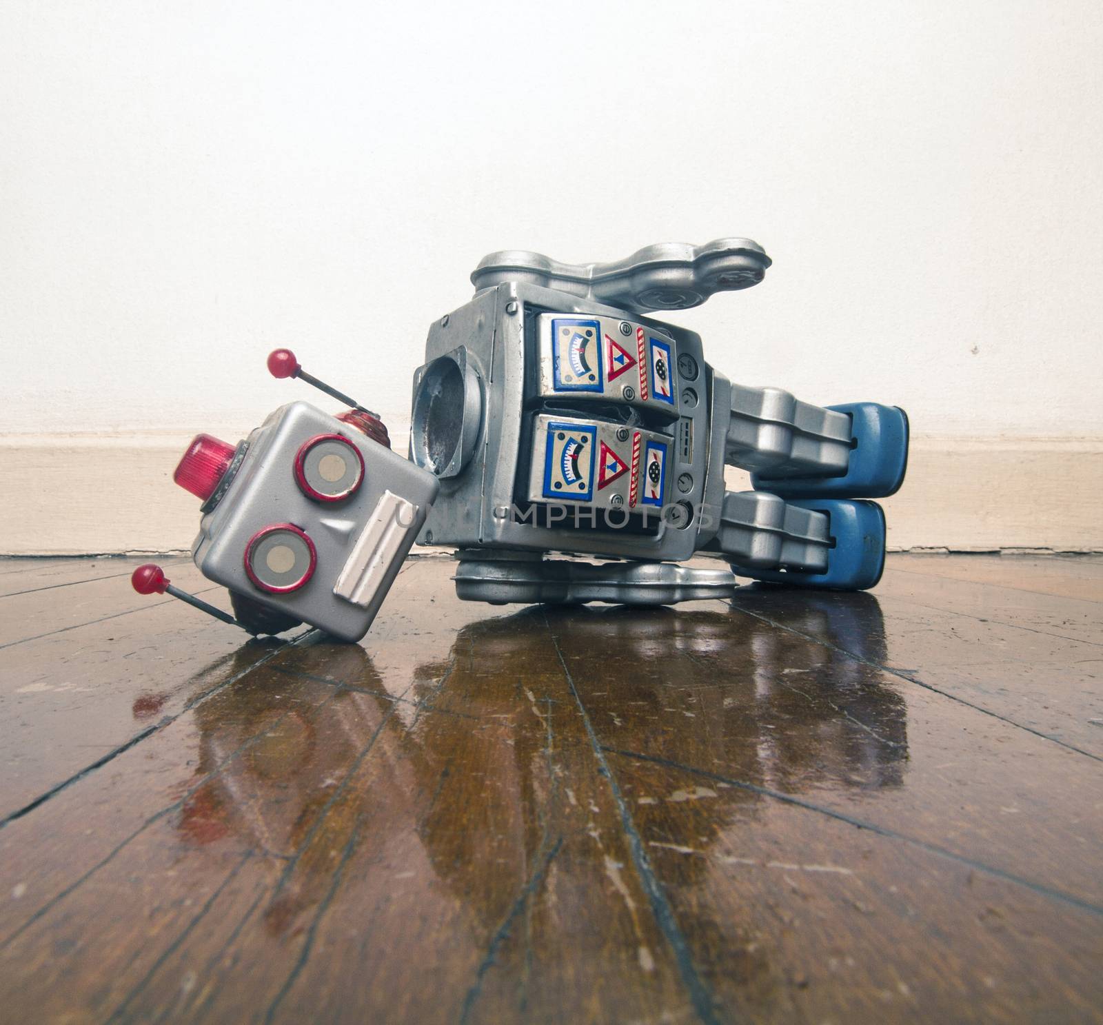 vintage bot lost his head on a old wooden floor with reflection 