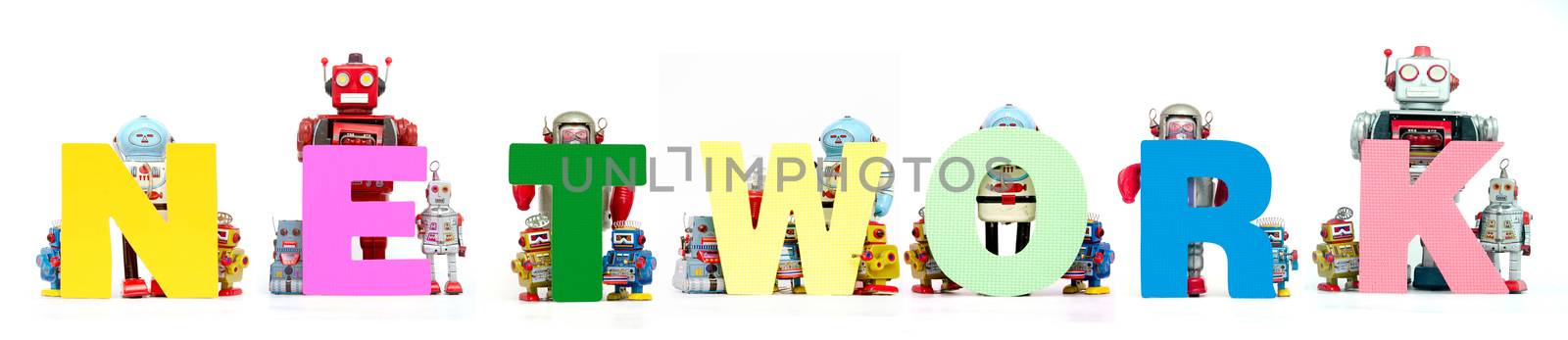 retro tin robot toys hold up the word  NETWORK  by davincidig