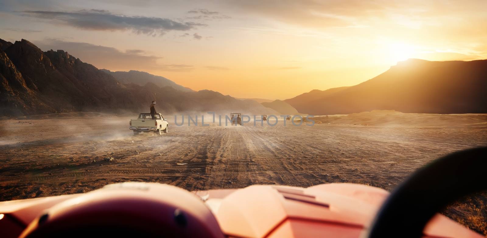 Buggy riding in egyptian desert at sunset, Egypt