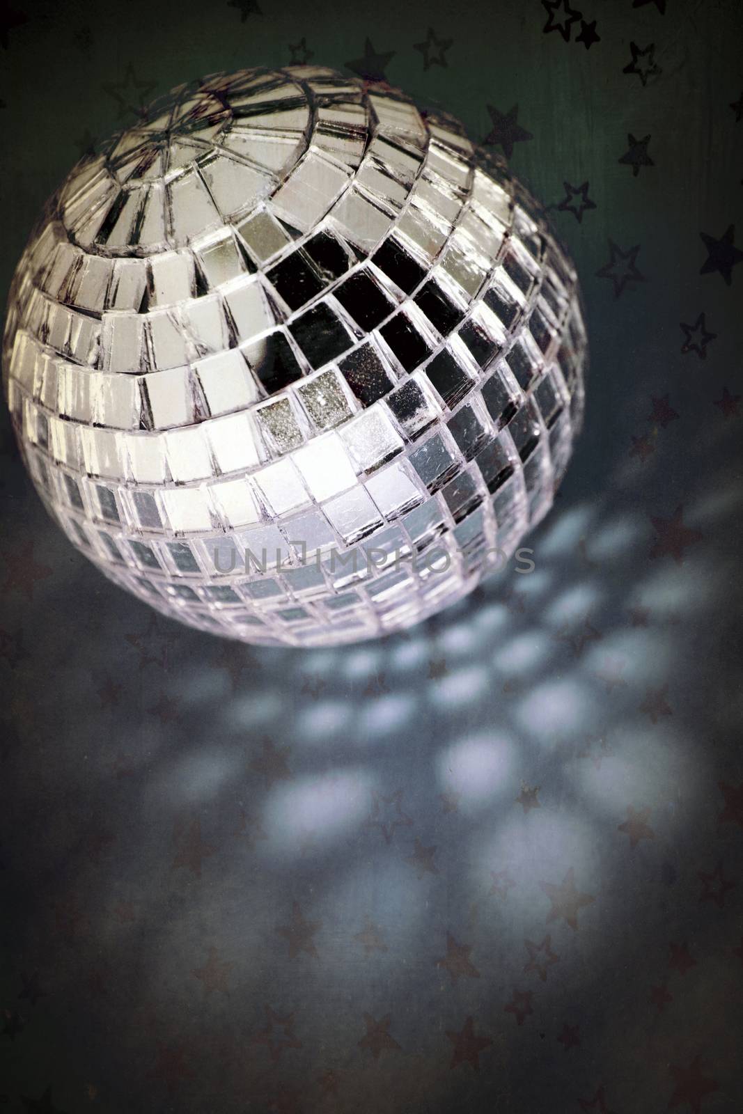 retro disco ball with stars and night sky blue background