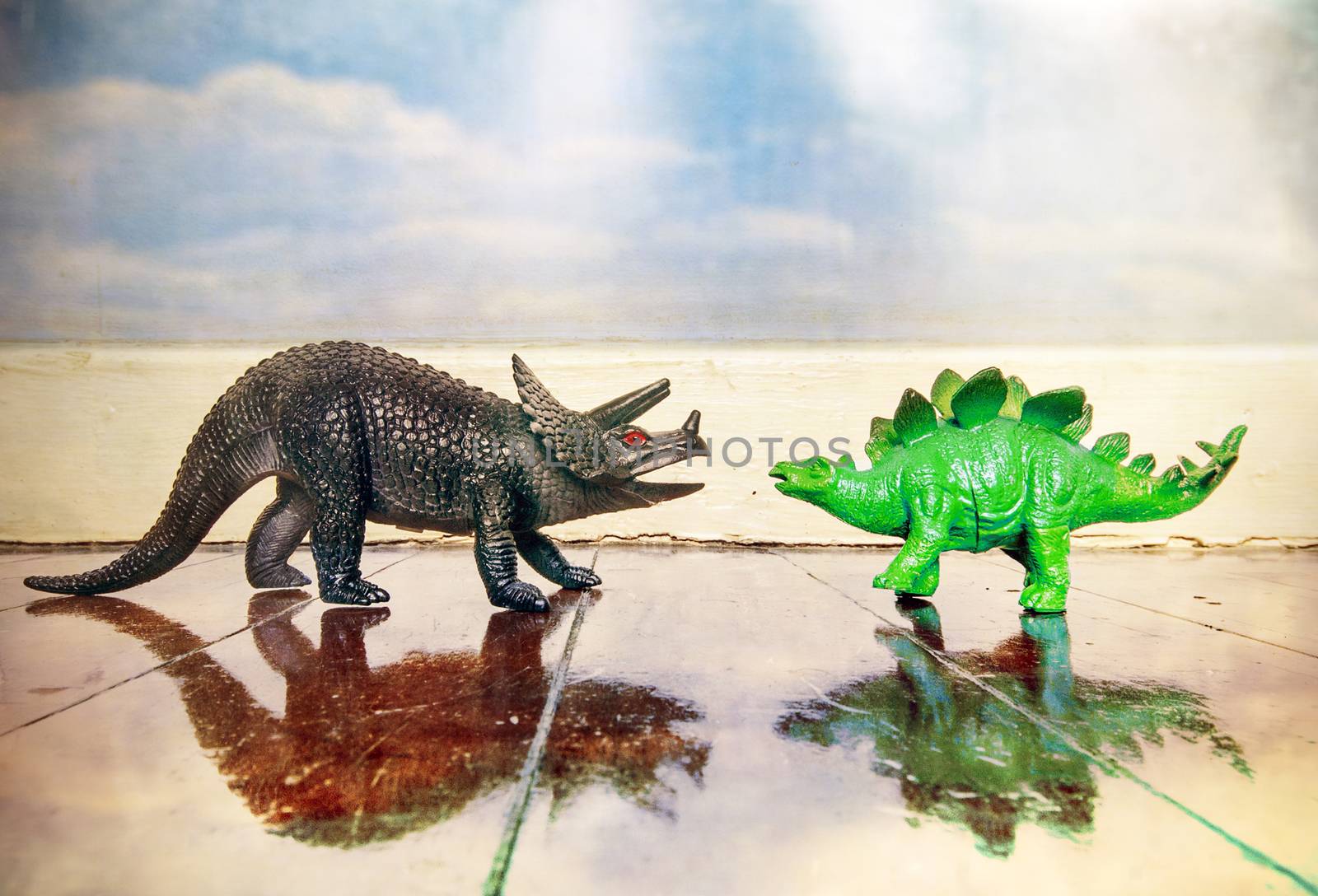 Stegosaurus and  styracosaurus; on a wooden floor with reflection