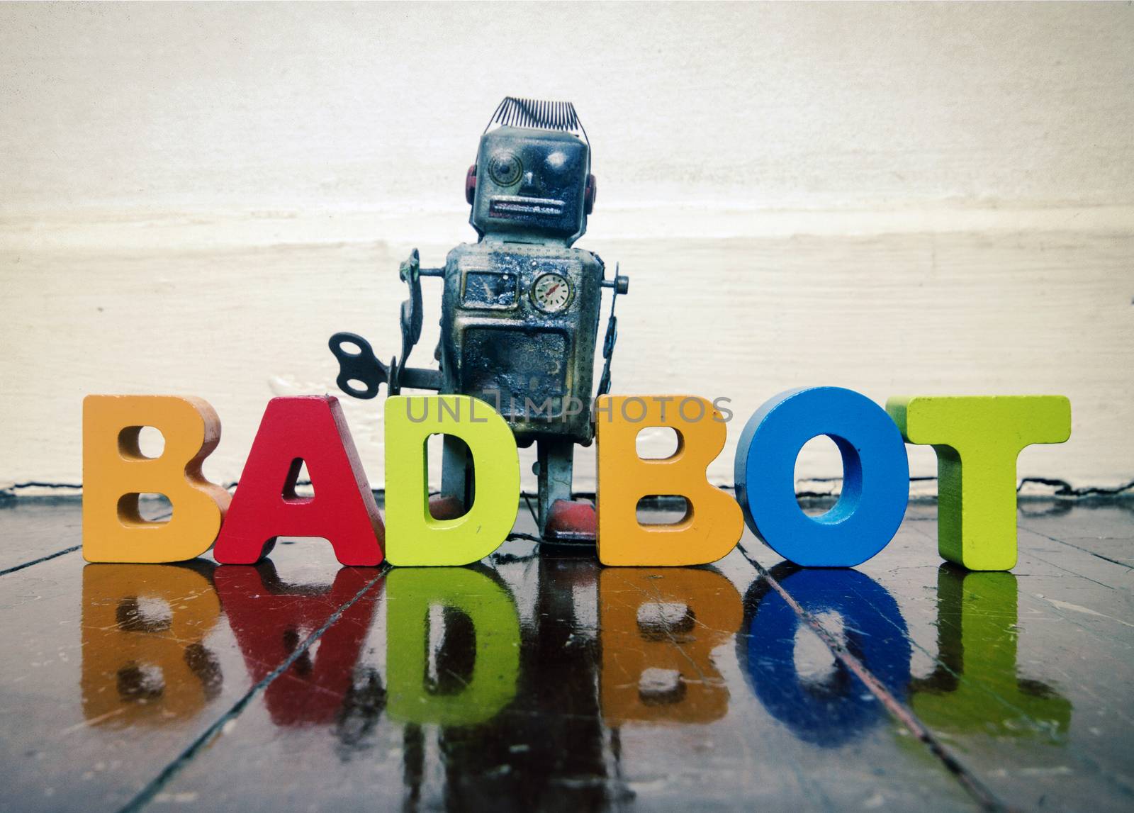 bad robot with word bad robot on a wooden floor with reflection 
