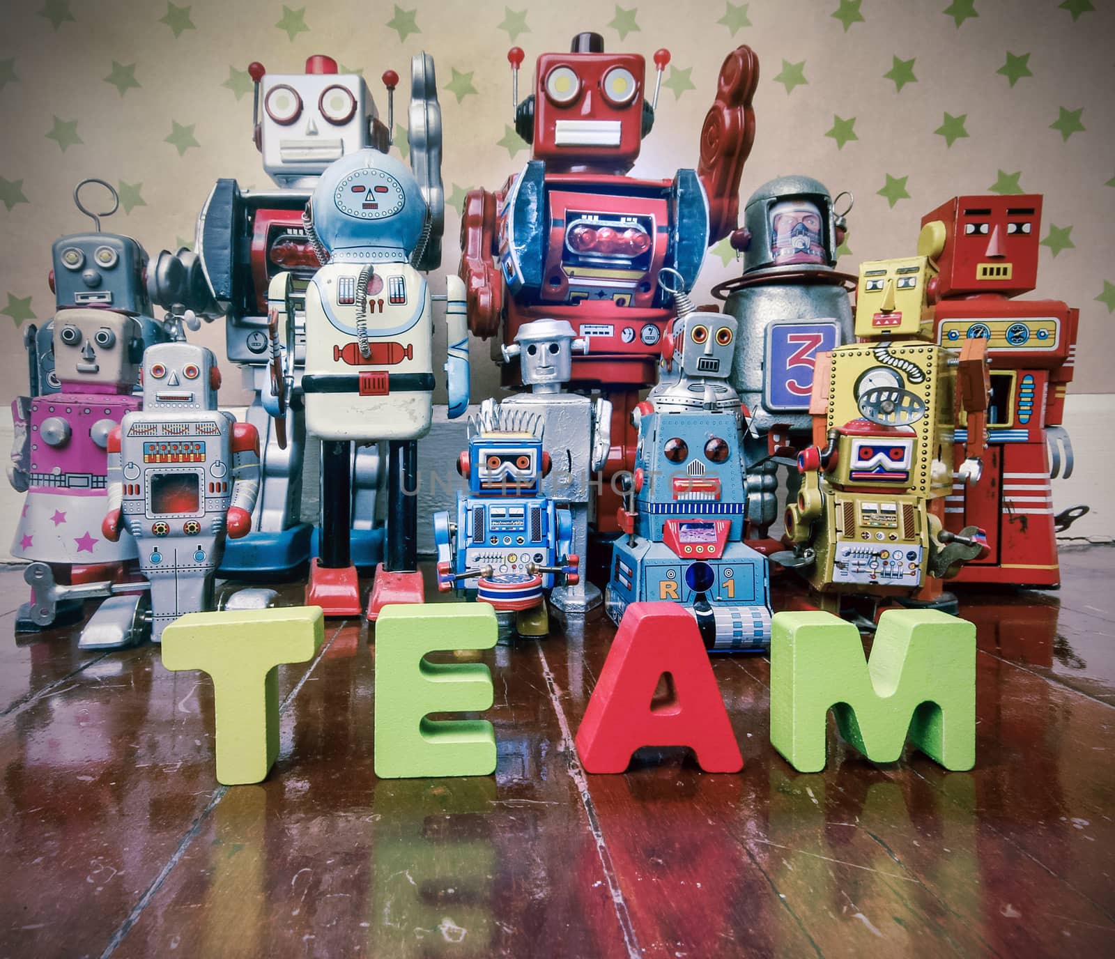 Concept TEAM WORK  wirh wooden letters and vintage robot toys