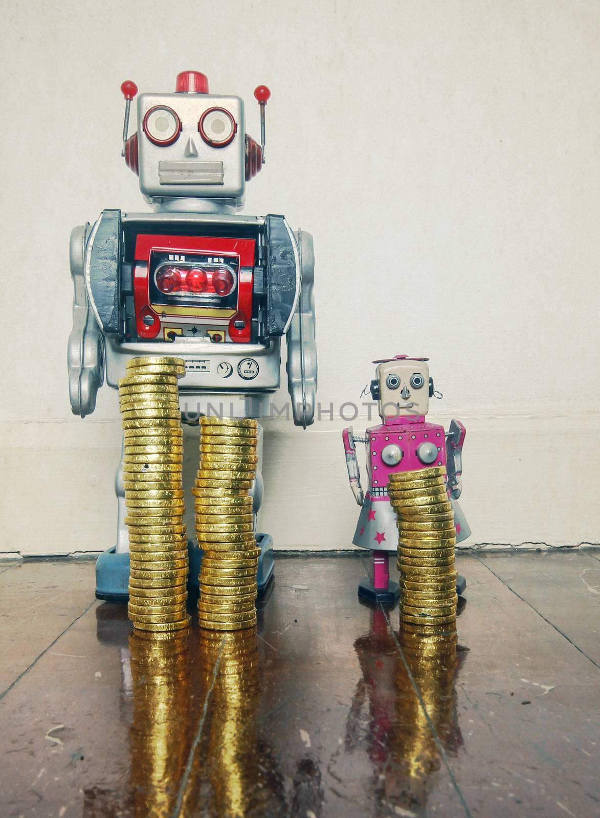 concept inequality wit two vintage robot toys on a wooden floor with reflection 