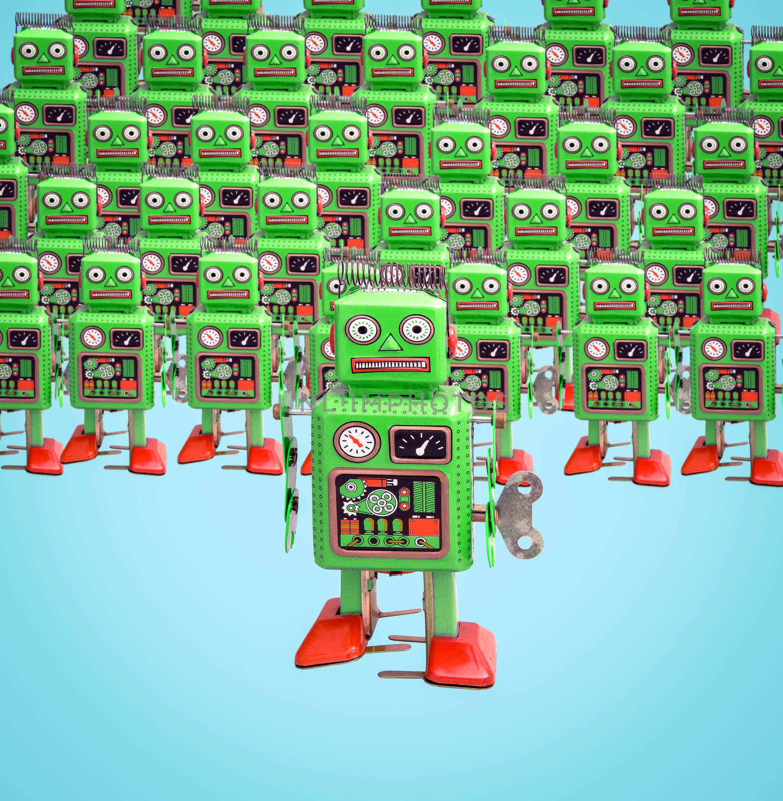 a army of green robot toys on  isolated on blue 