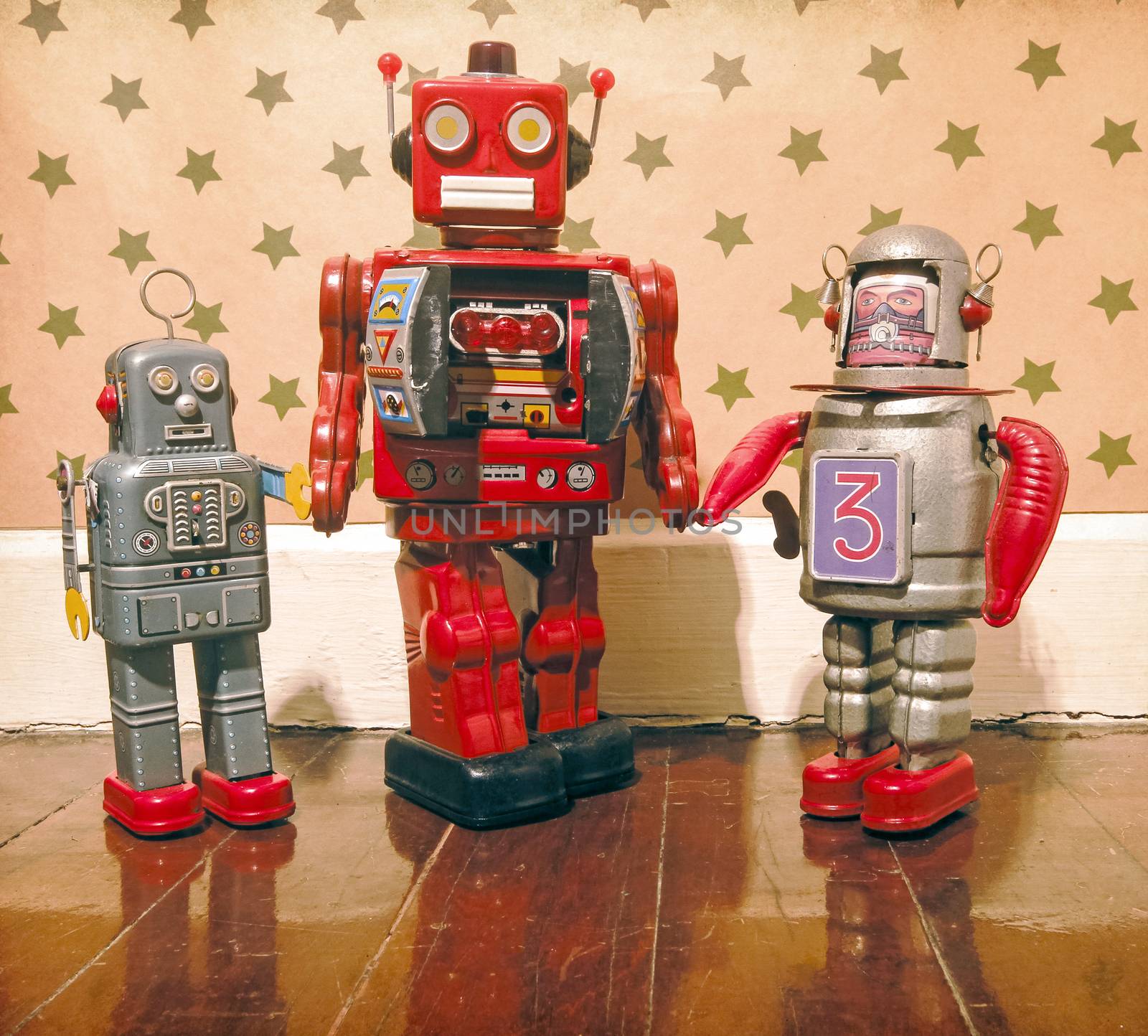 retro robot dad and is sons standing on an old wooden floor with reflection 