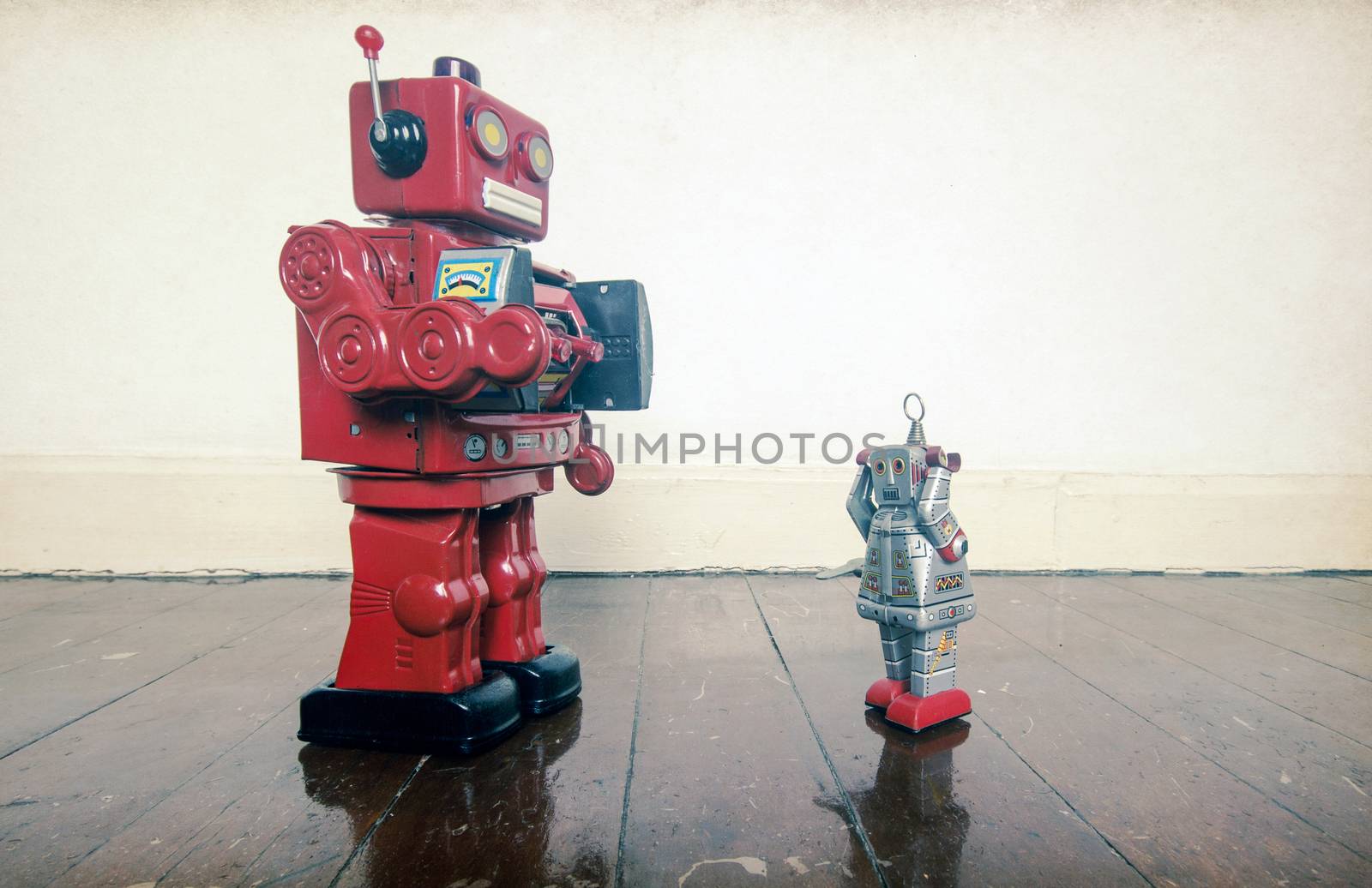 stick them up , robo cop puts robot undr arrest , on old wooden floor with reflection