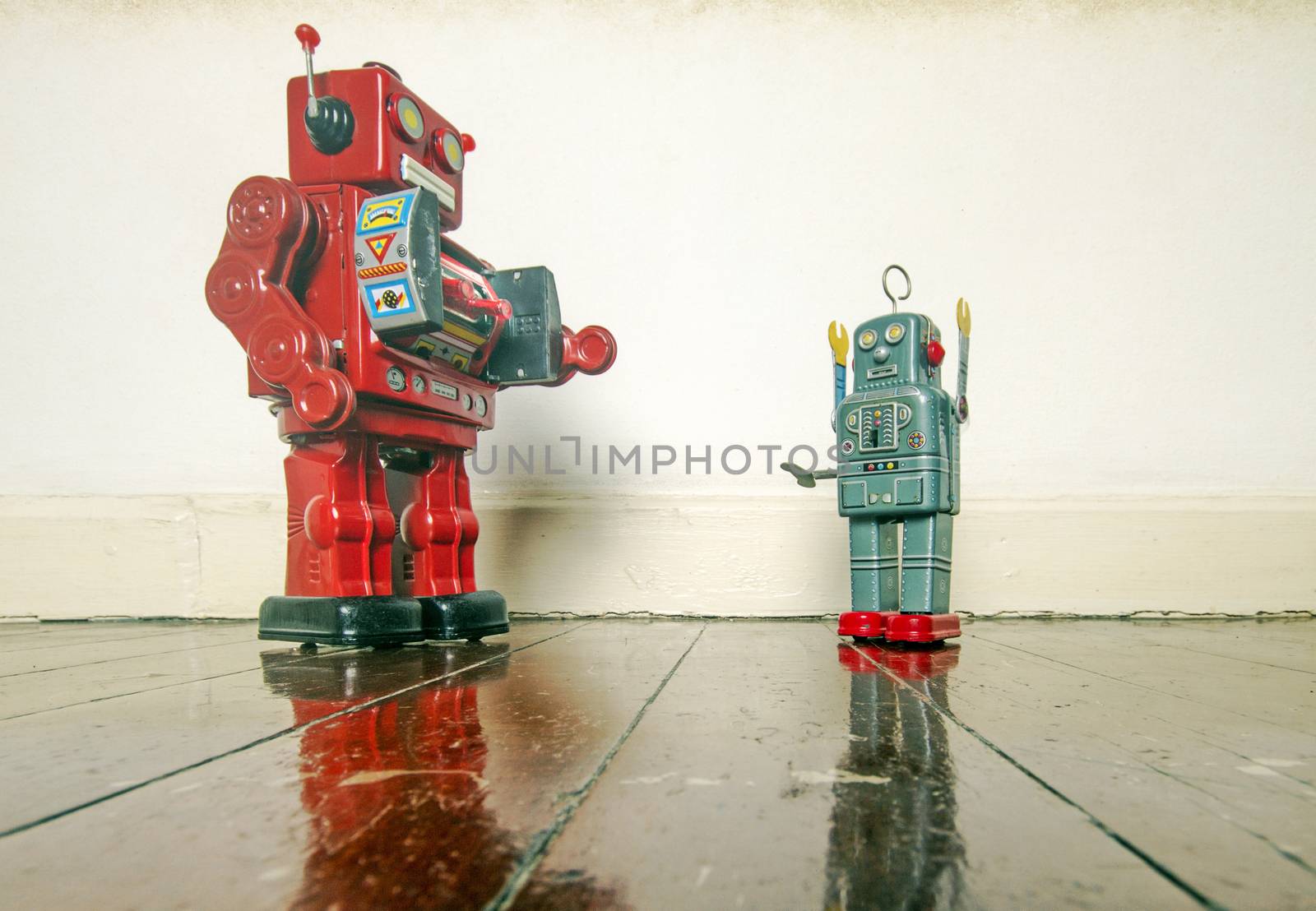 stick them up , robo cop puts robot undr arrest , on old wooden floor with reflection